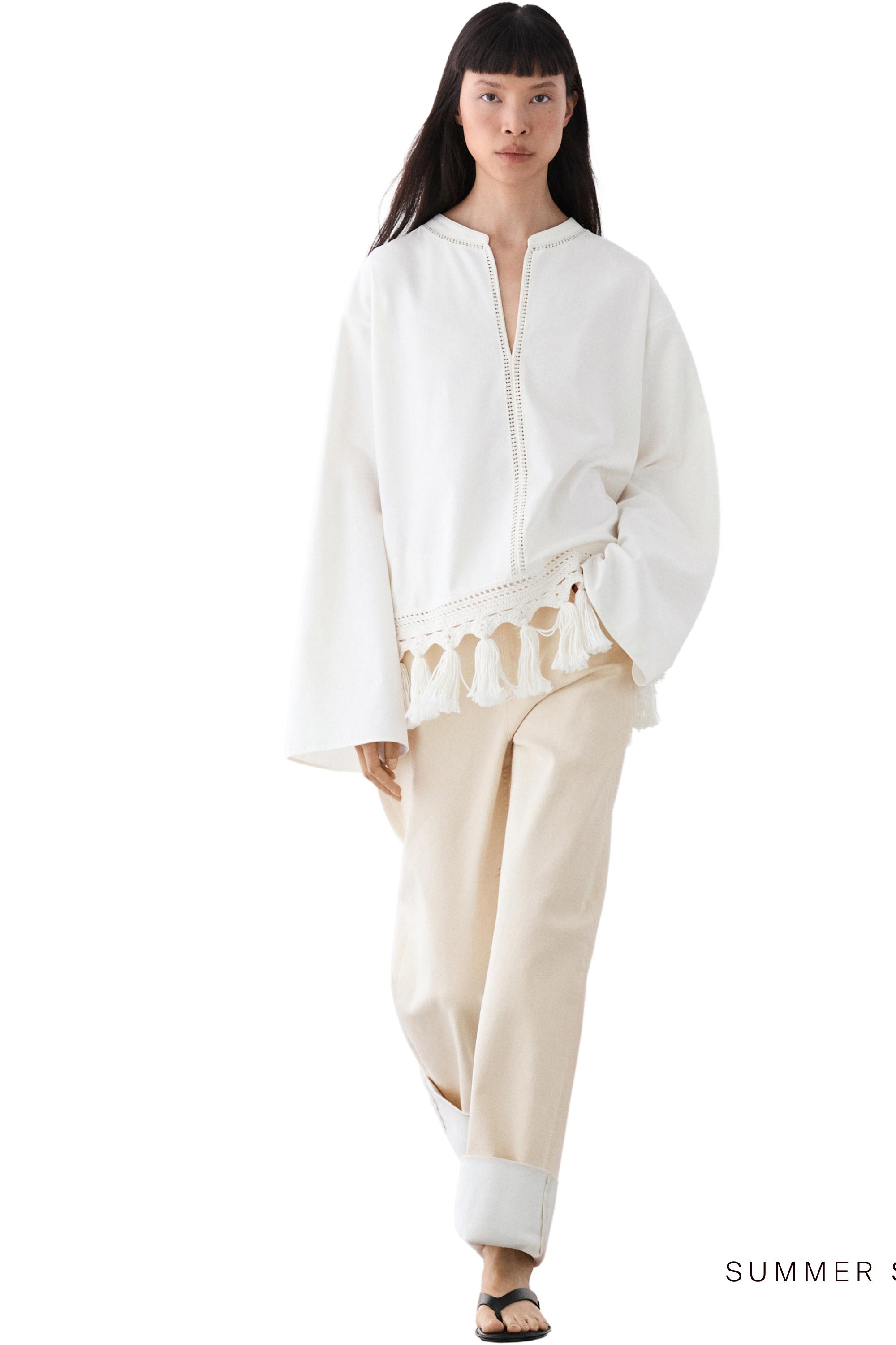 Embroidered blouse with fringed hem — WHITE