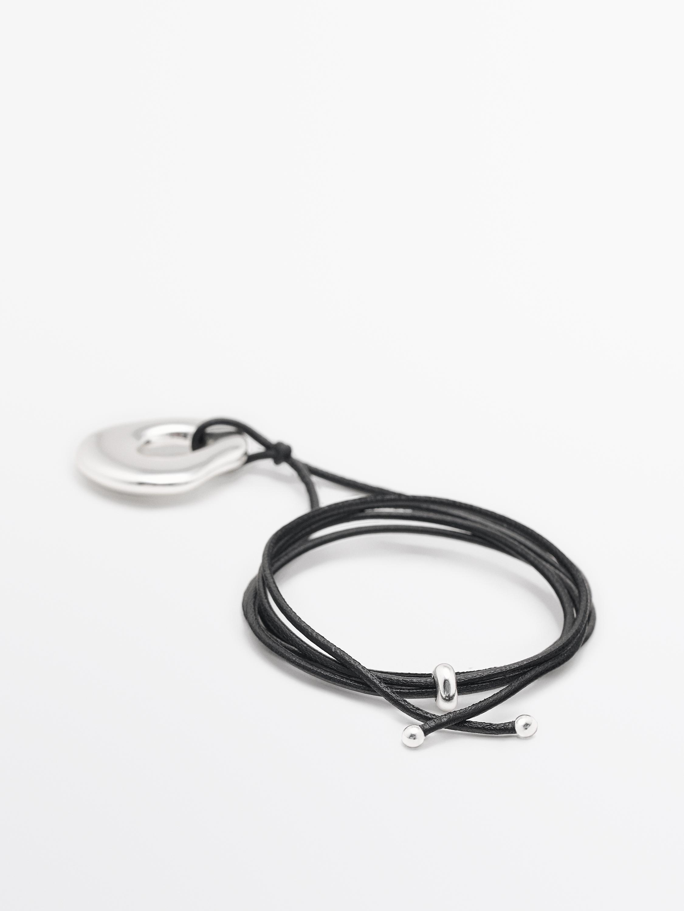 Leather cord necklace with piece