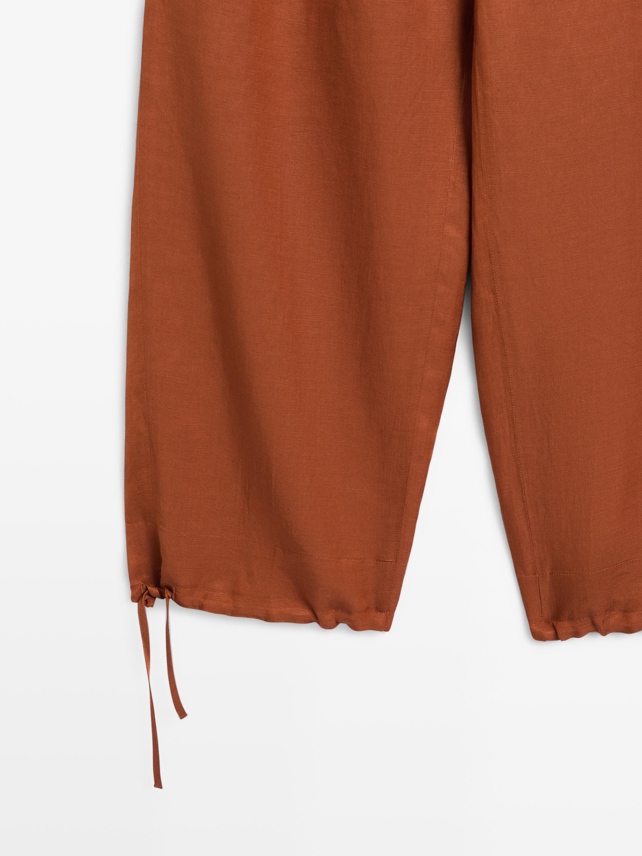 Flowing trousers with tie detail — ORANGE