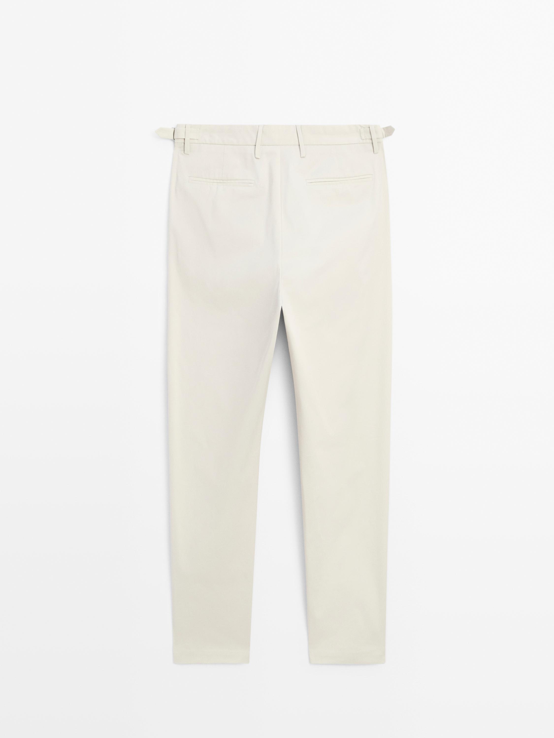 Tapered fit trousers with buckle detail