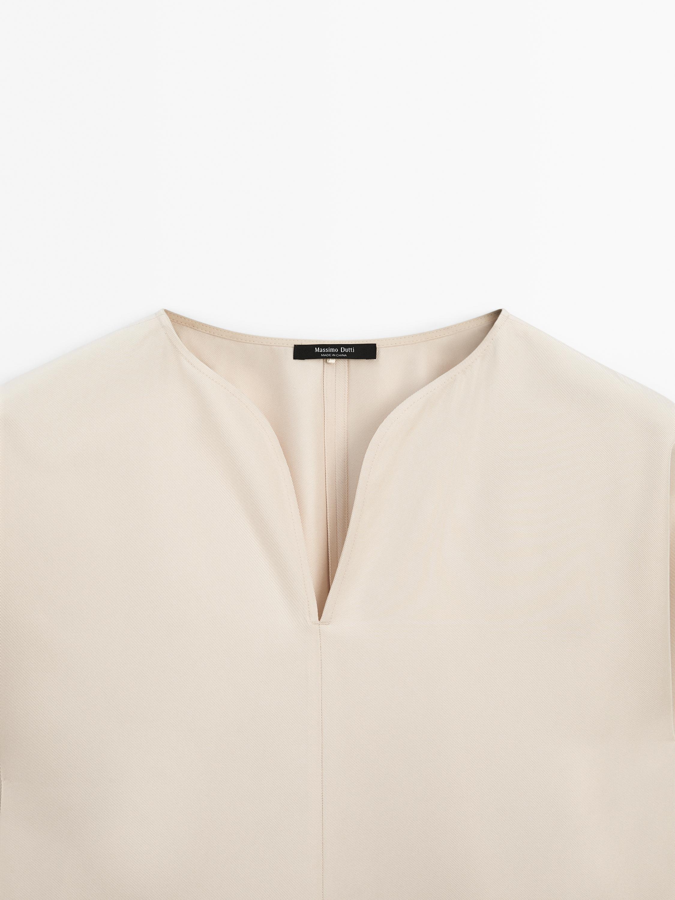 Flowing blouse with slit details