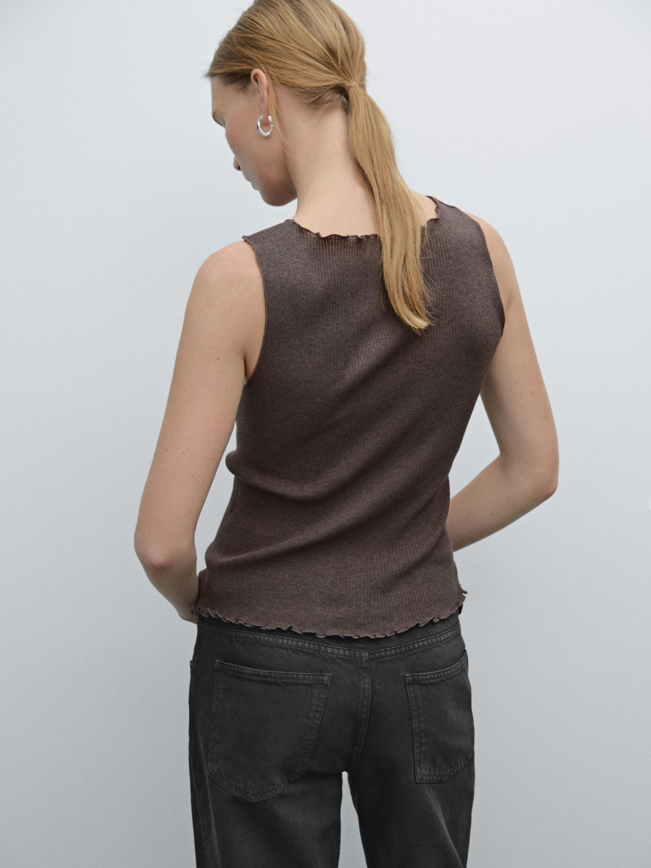 Knit waistcoat top with buttoned strap