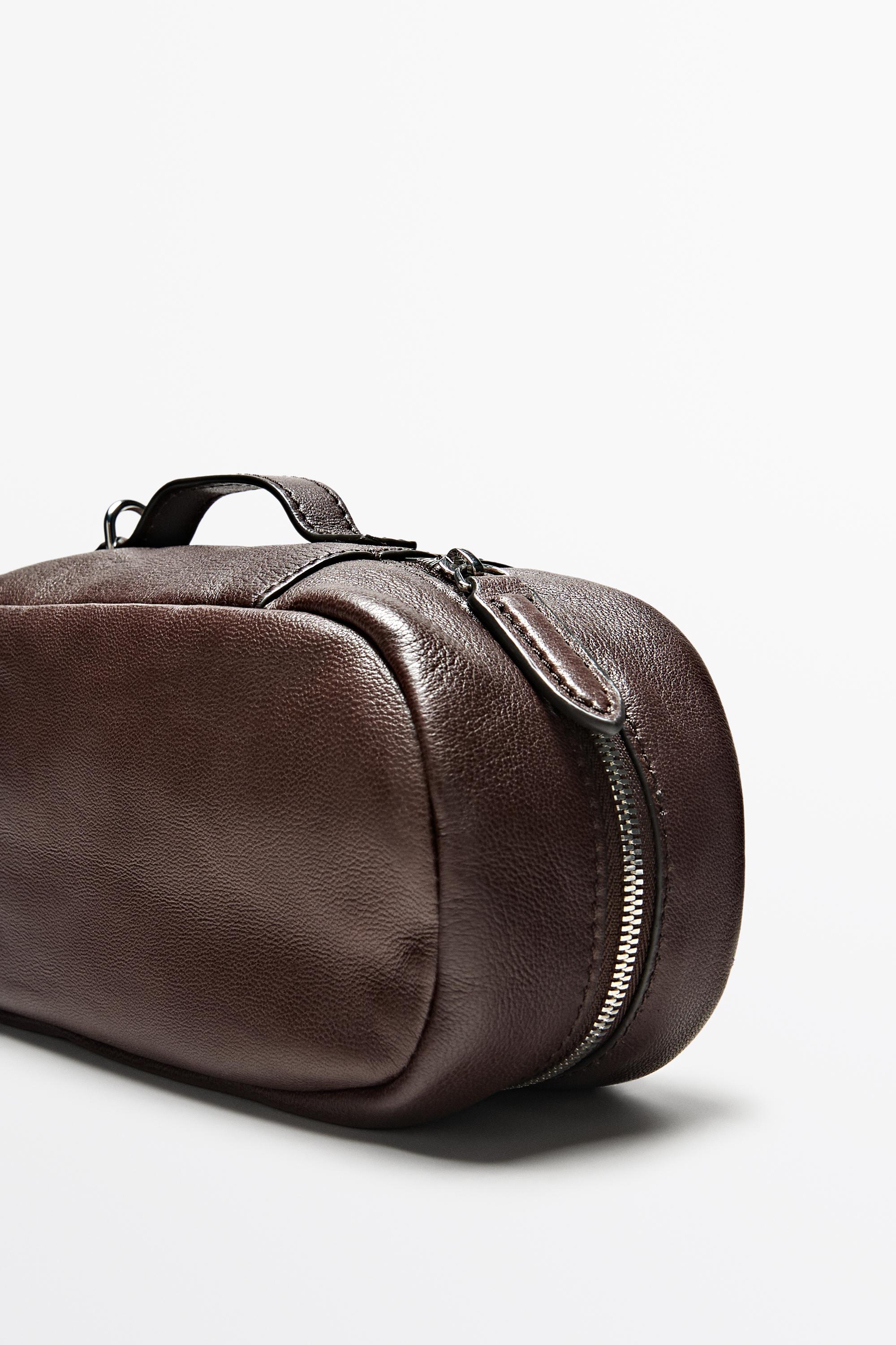 Oval nappa leather toiletry bag — BROWN