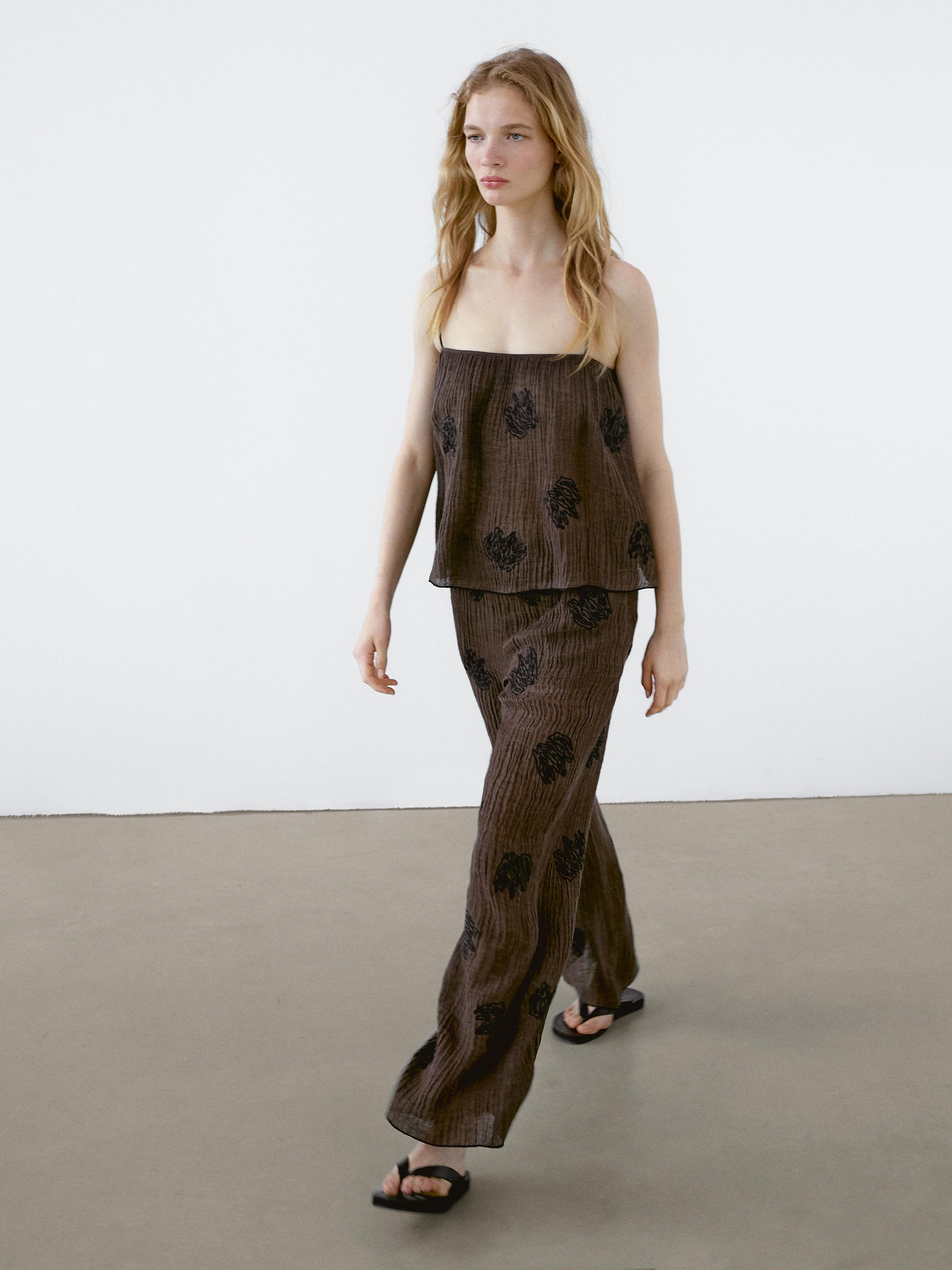 Flowing textured top with embroidered detail