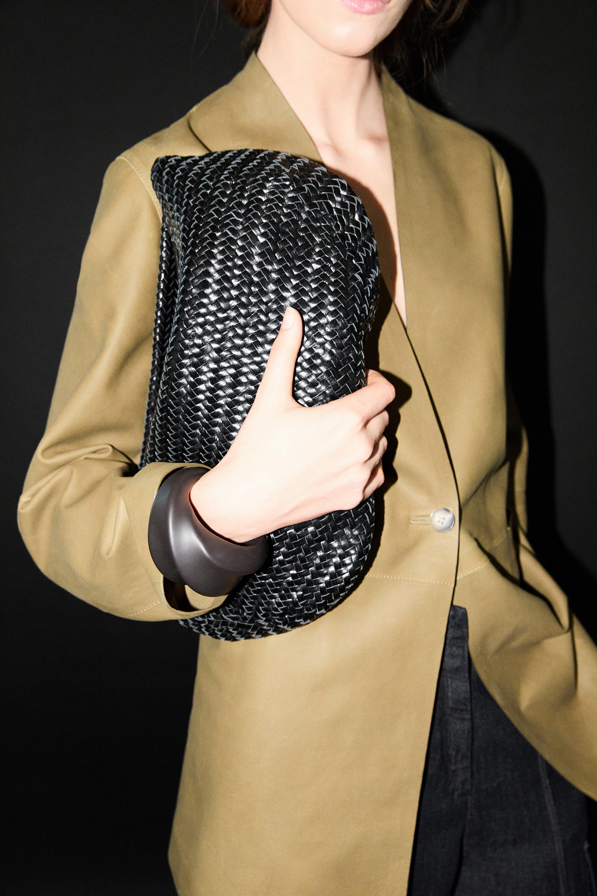 Braided leather half-moon bag — BLACK