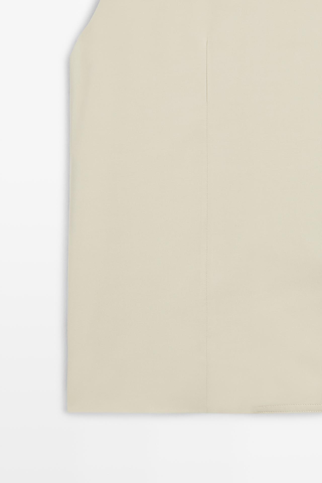 Flowing vest with asymmetric button closure — Beige