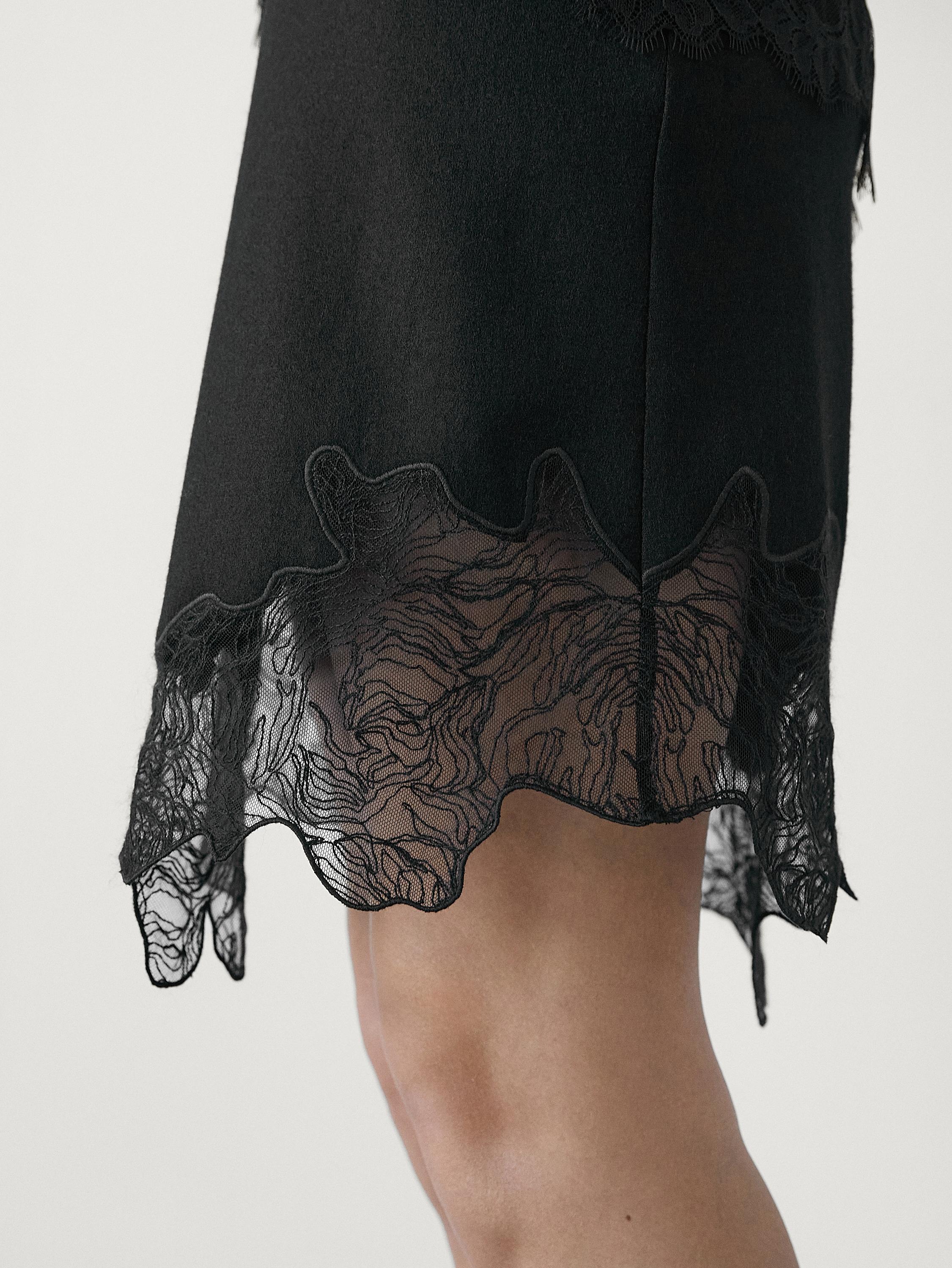 Short asymmetric lace-trimmed skirt