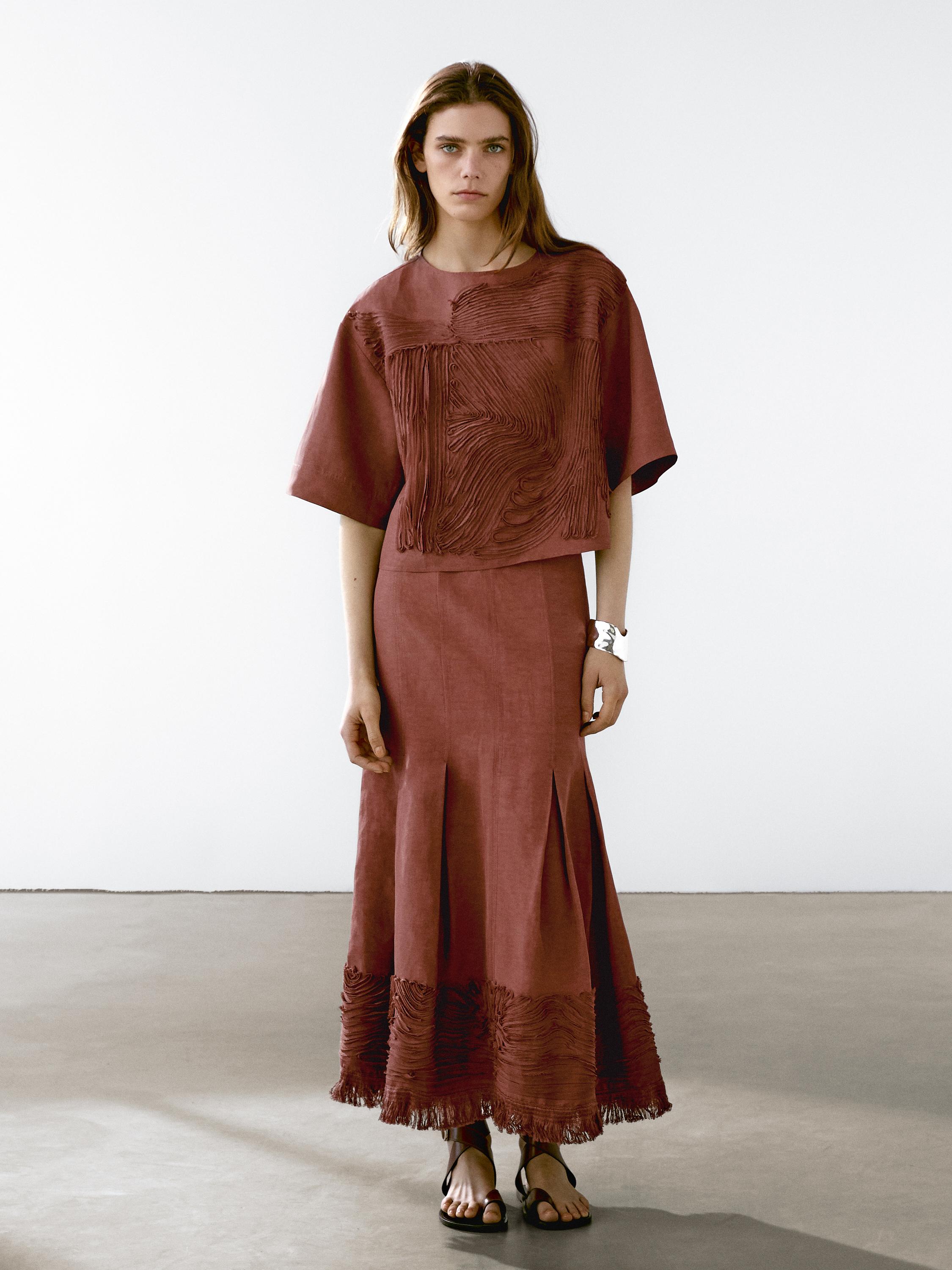 Flowing midi skirt with embroidered detail