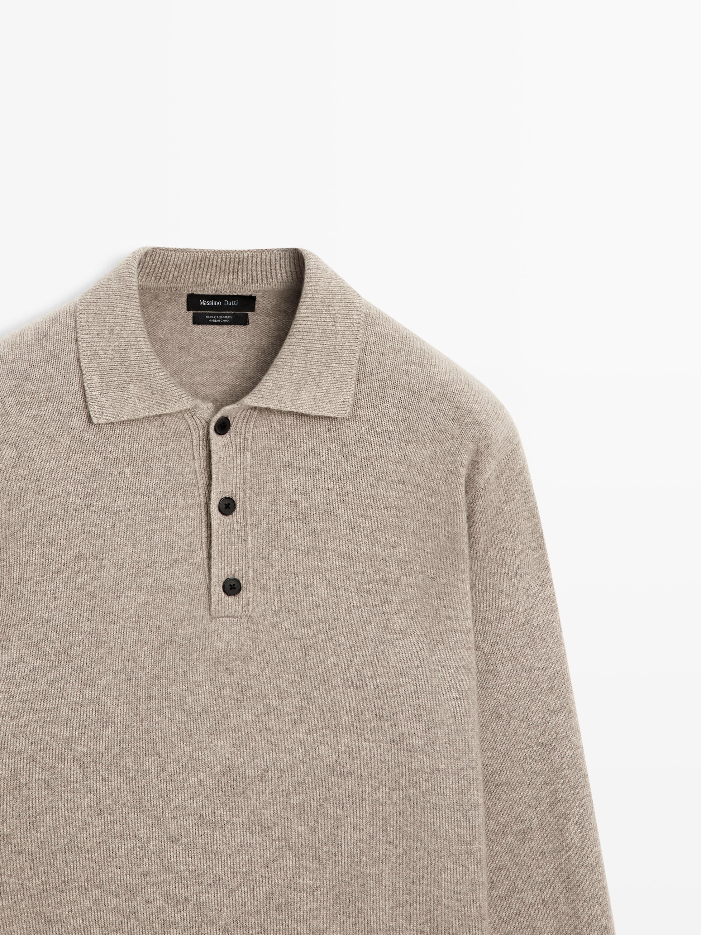 "Medium shot of a mink polo jersey with a classic collar and a three-black-button placket."