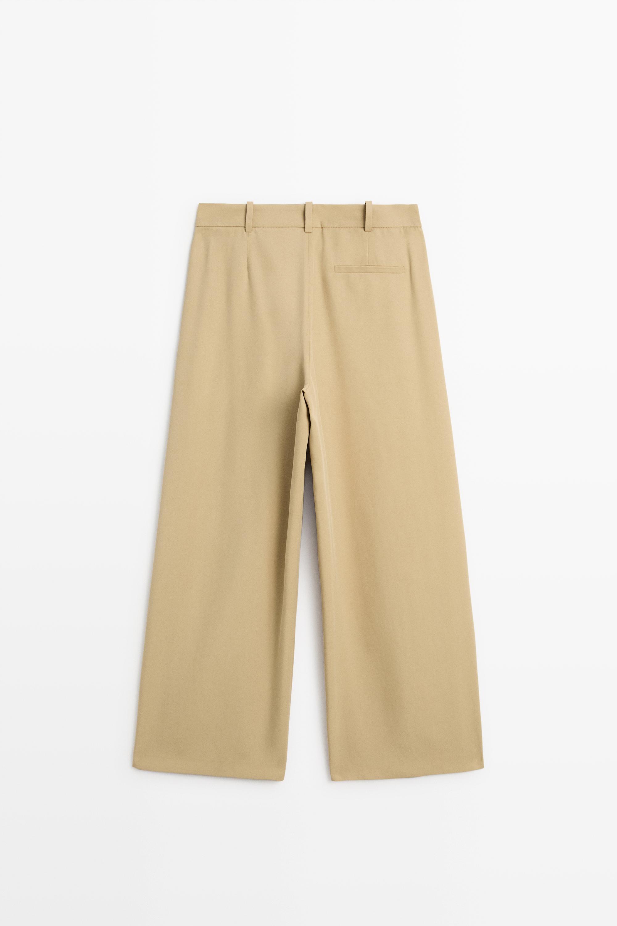 Flowing pleated pants with button detail — BEIGE