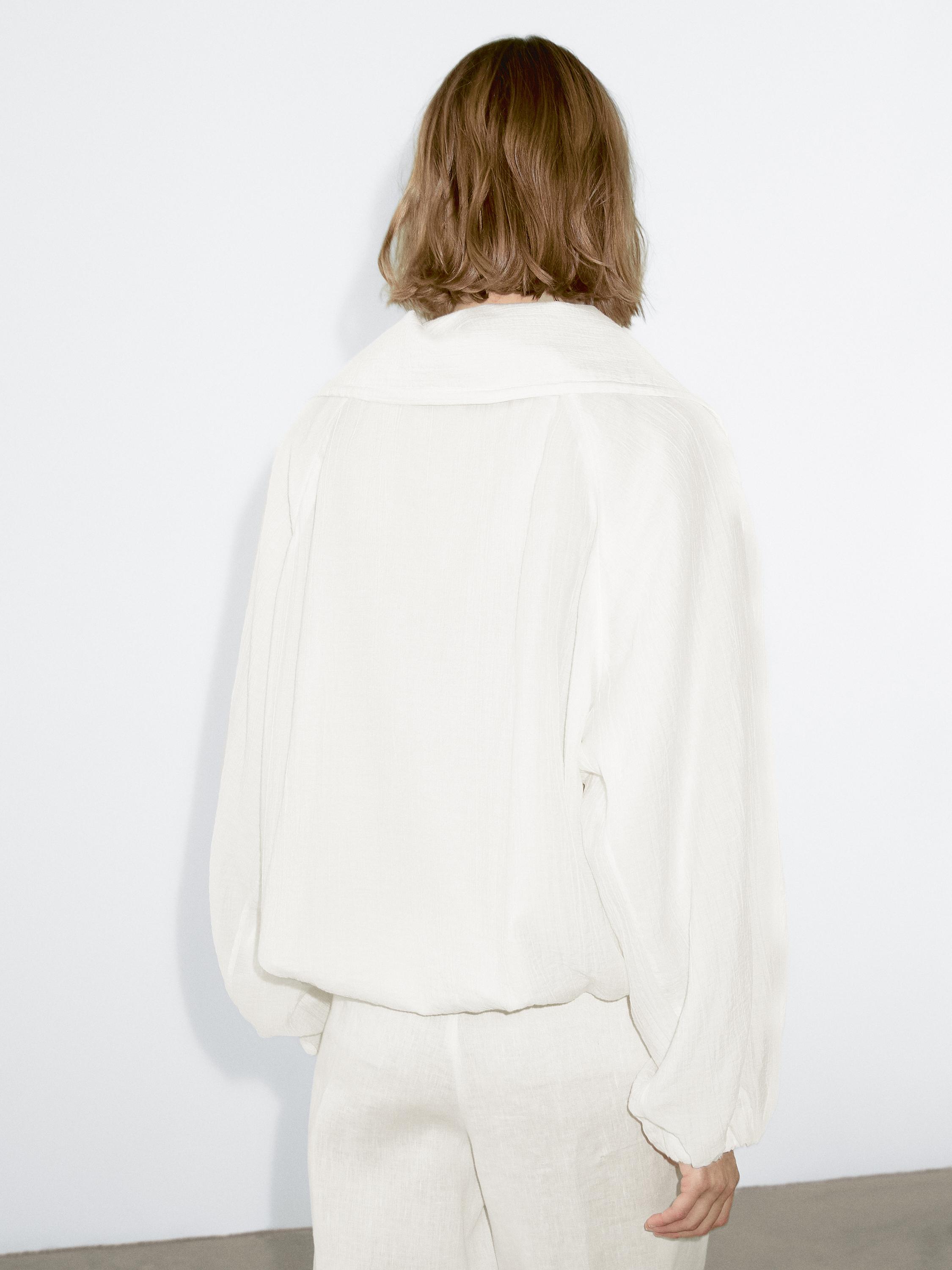 Flowing bomber jacket with voluminous detail