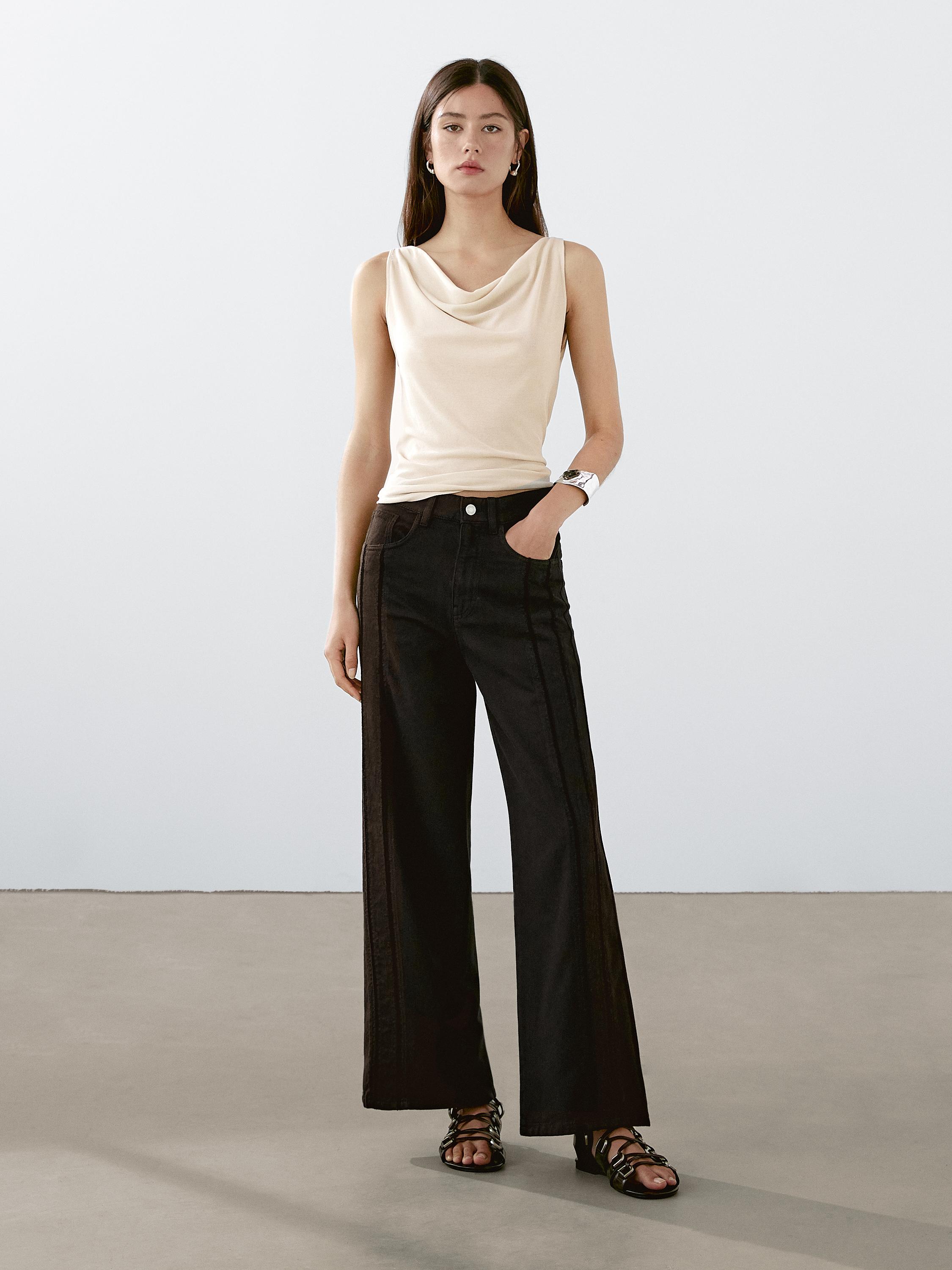 Sleeveless top with draped neckline