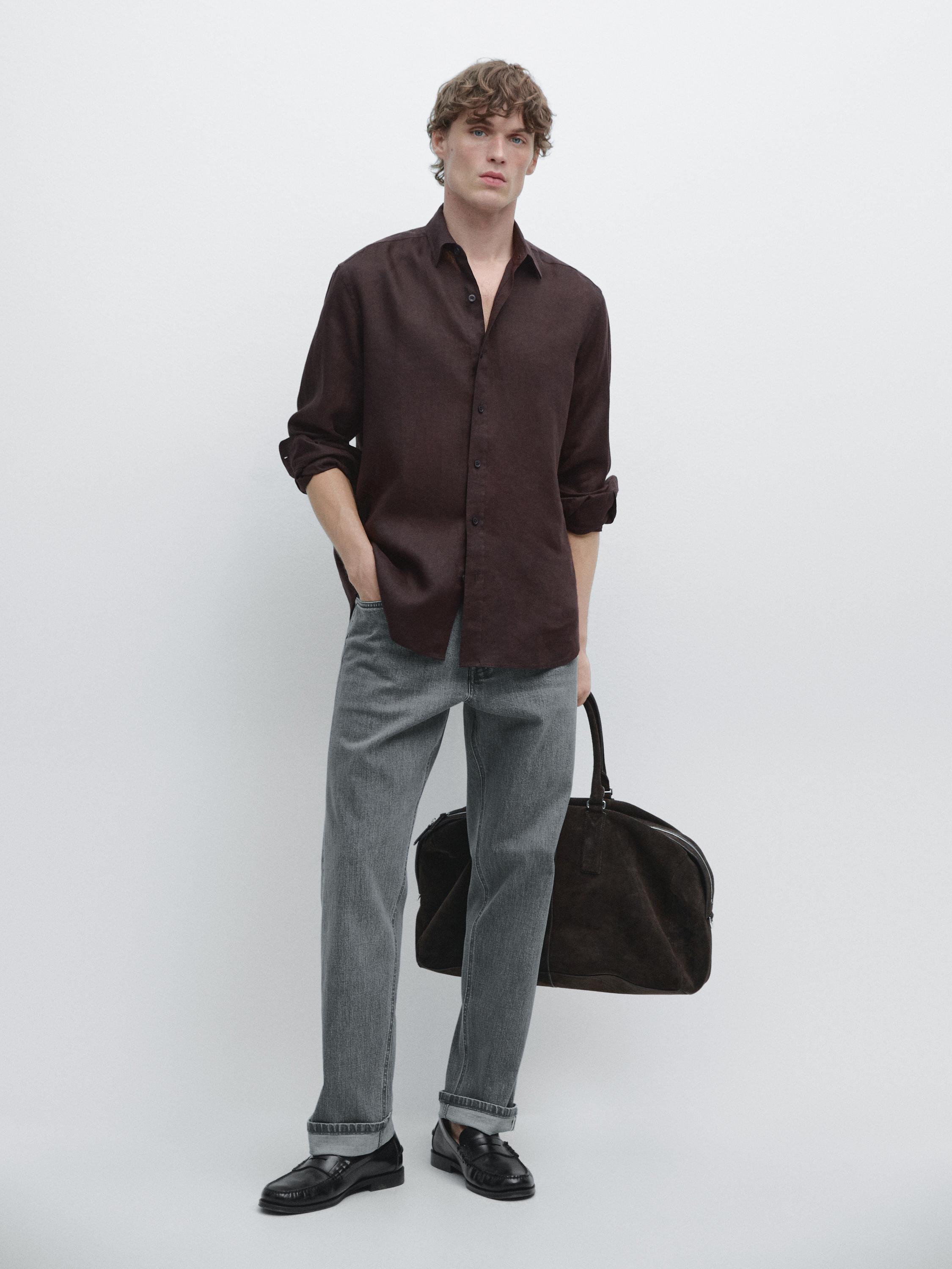 Burgundy long-sleeve shirt and straight gray pants set. Shirt with front button placket and folded cuffs.
