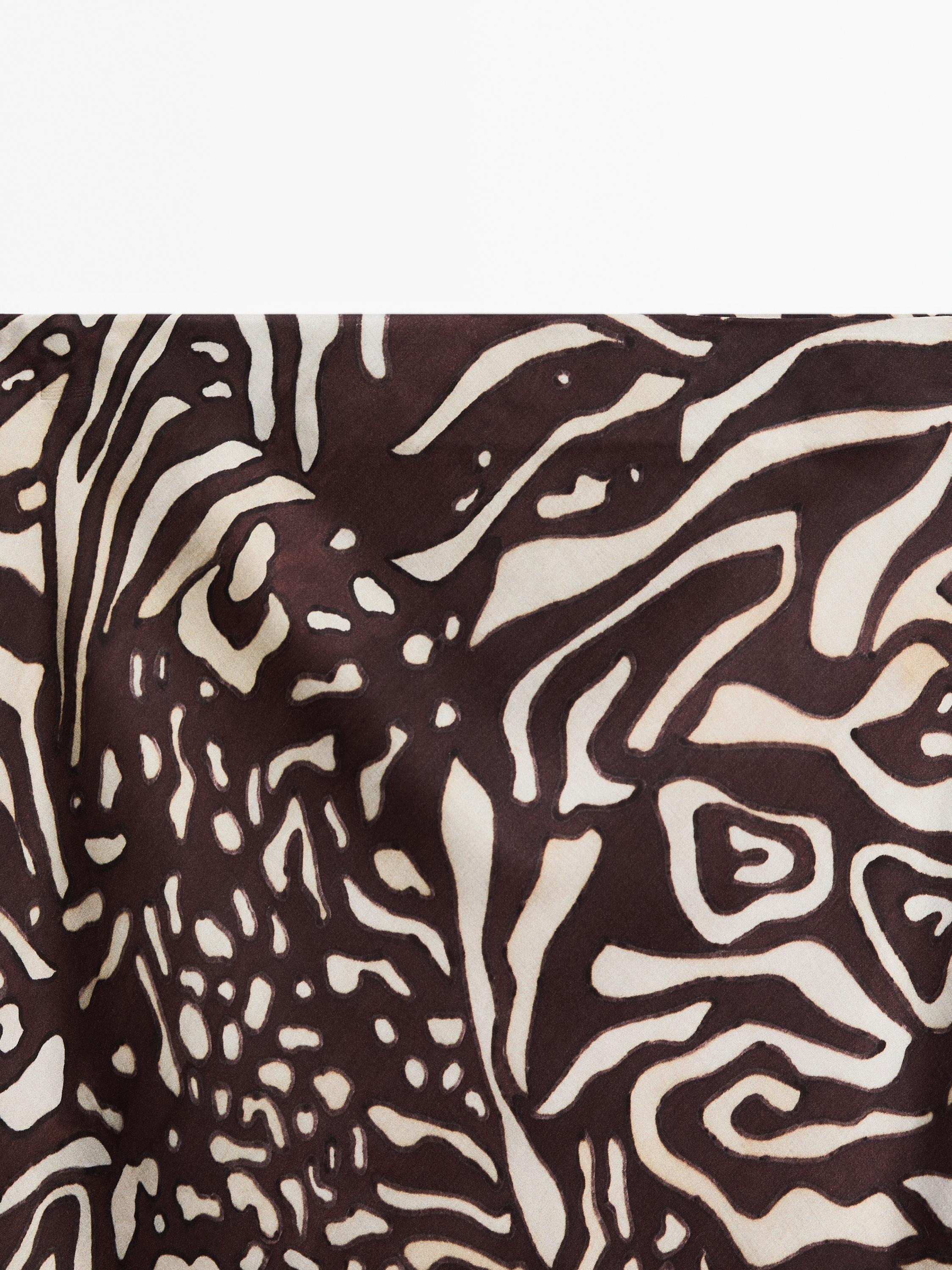 Saia midi fluida com animal print