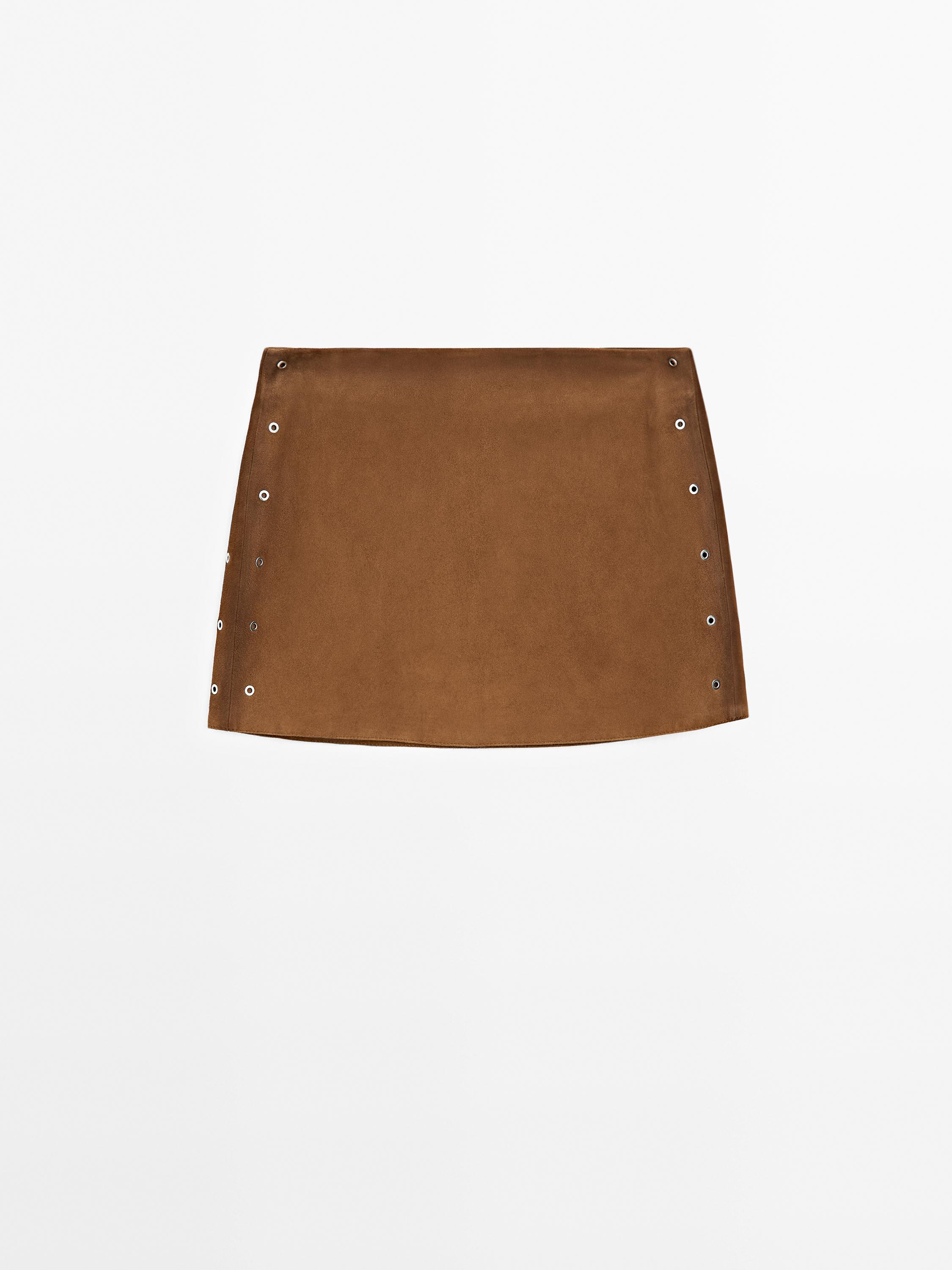Minijupe œillets en cuir finition daim