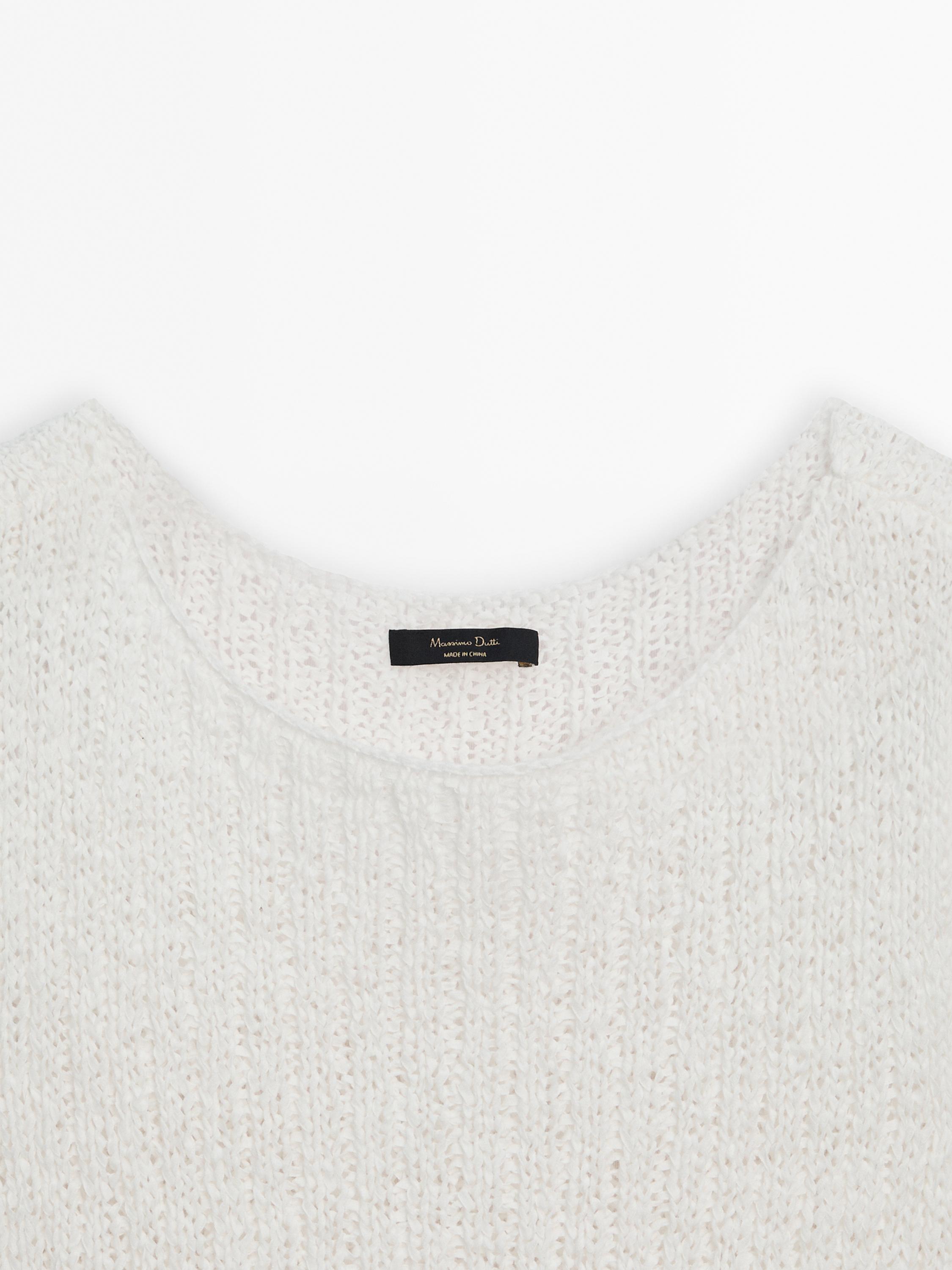 Knit top with asymmetric hem