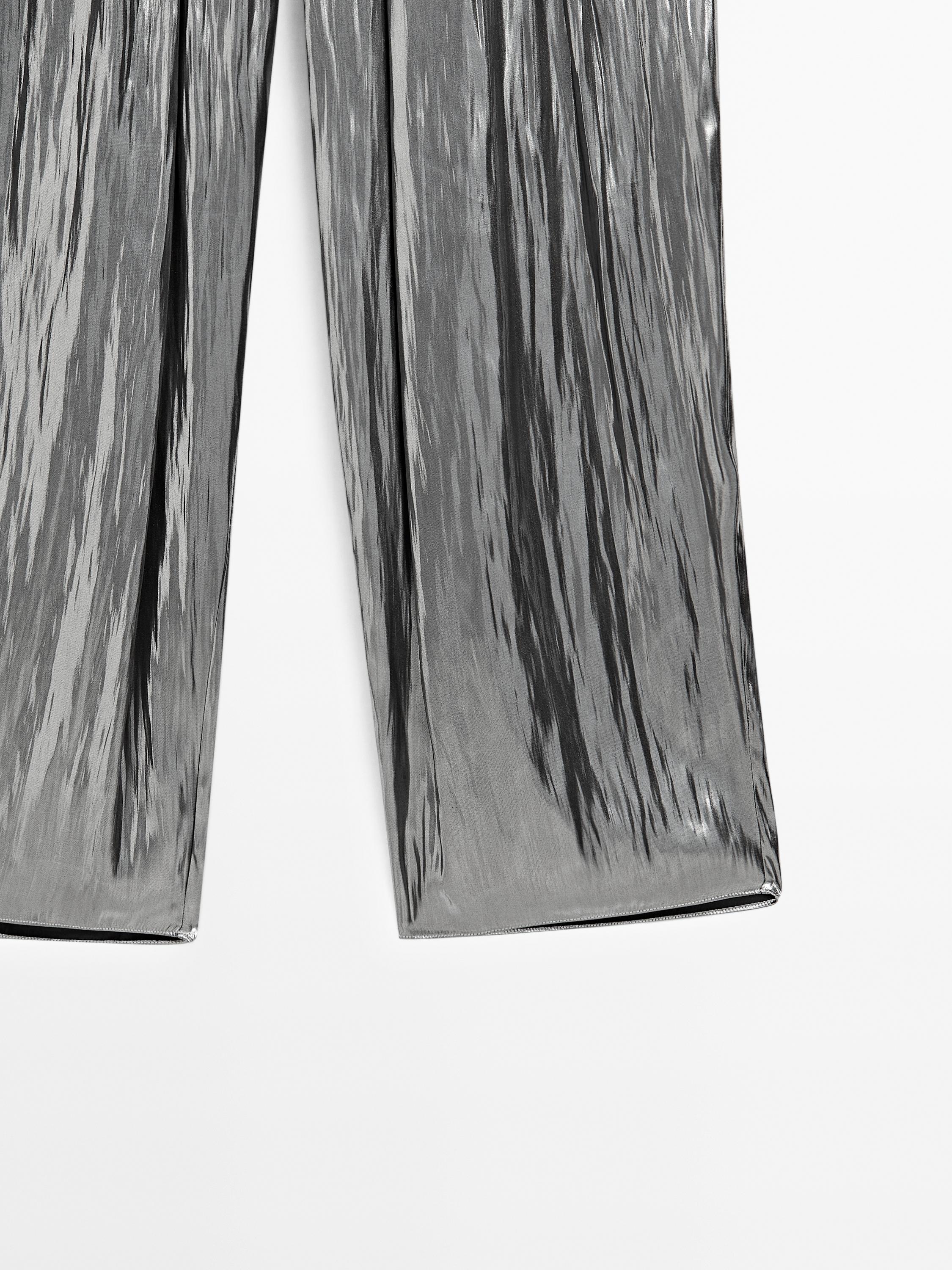 Flowing metallic trousers with gathered detail