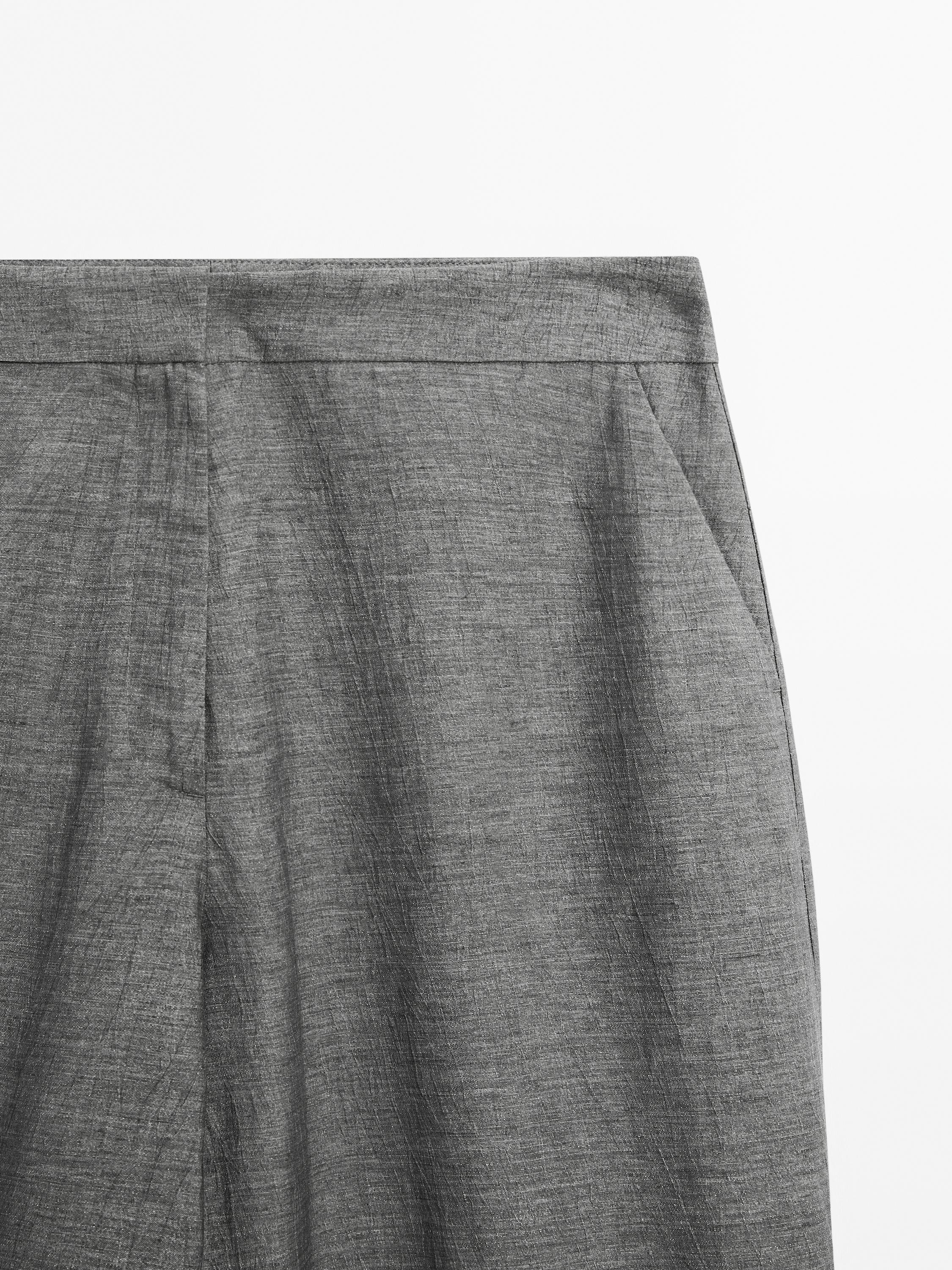 Balloon fit trousers with button details