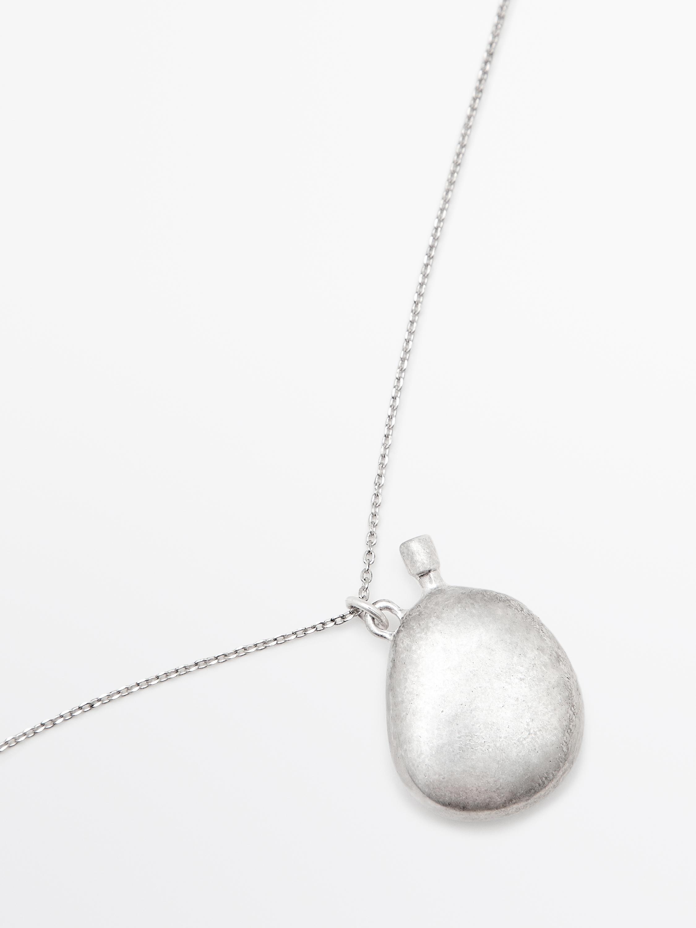 Necklace with metal pendant