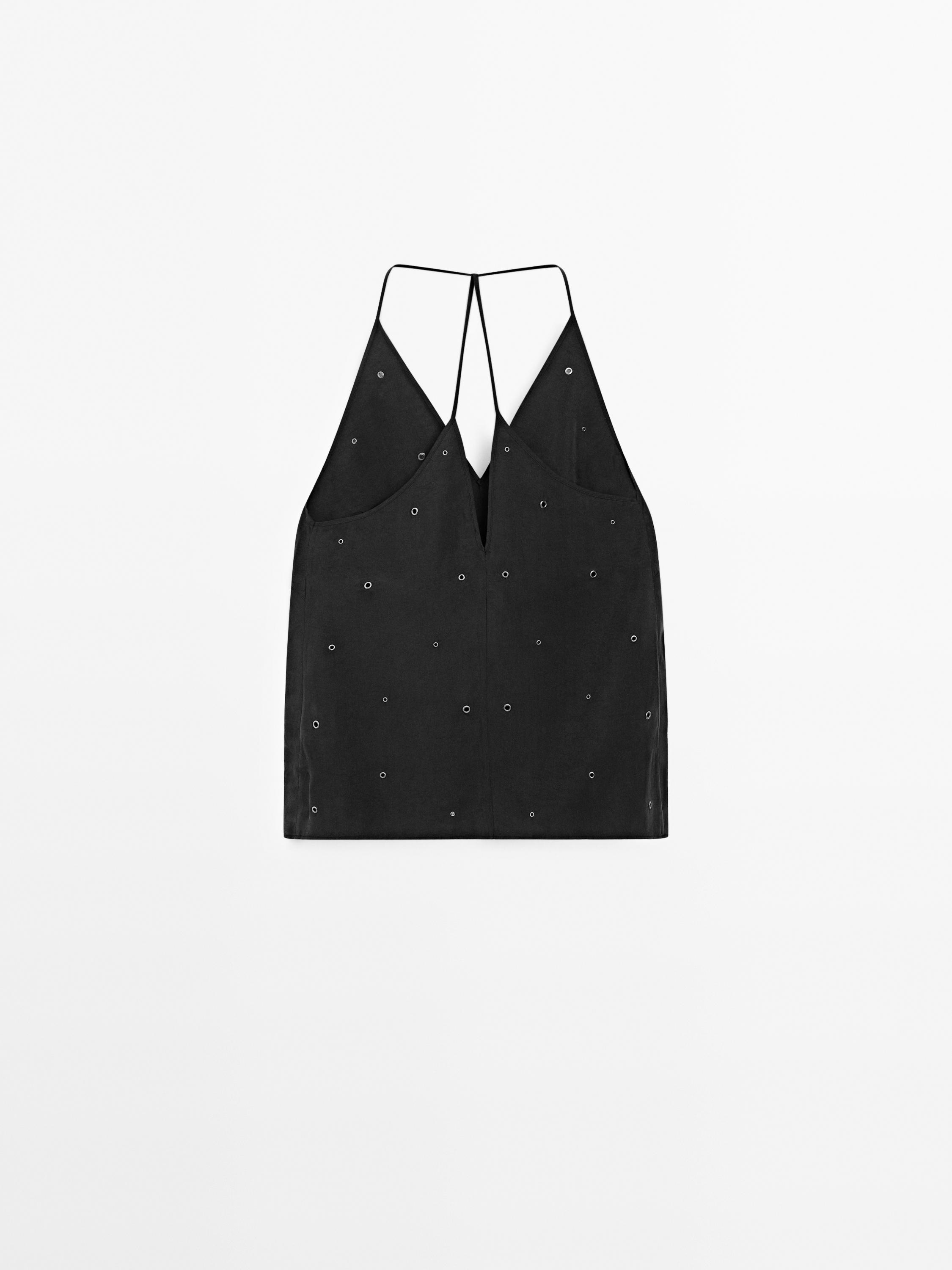 Flowing top with eyelets