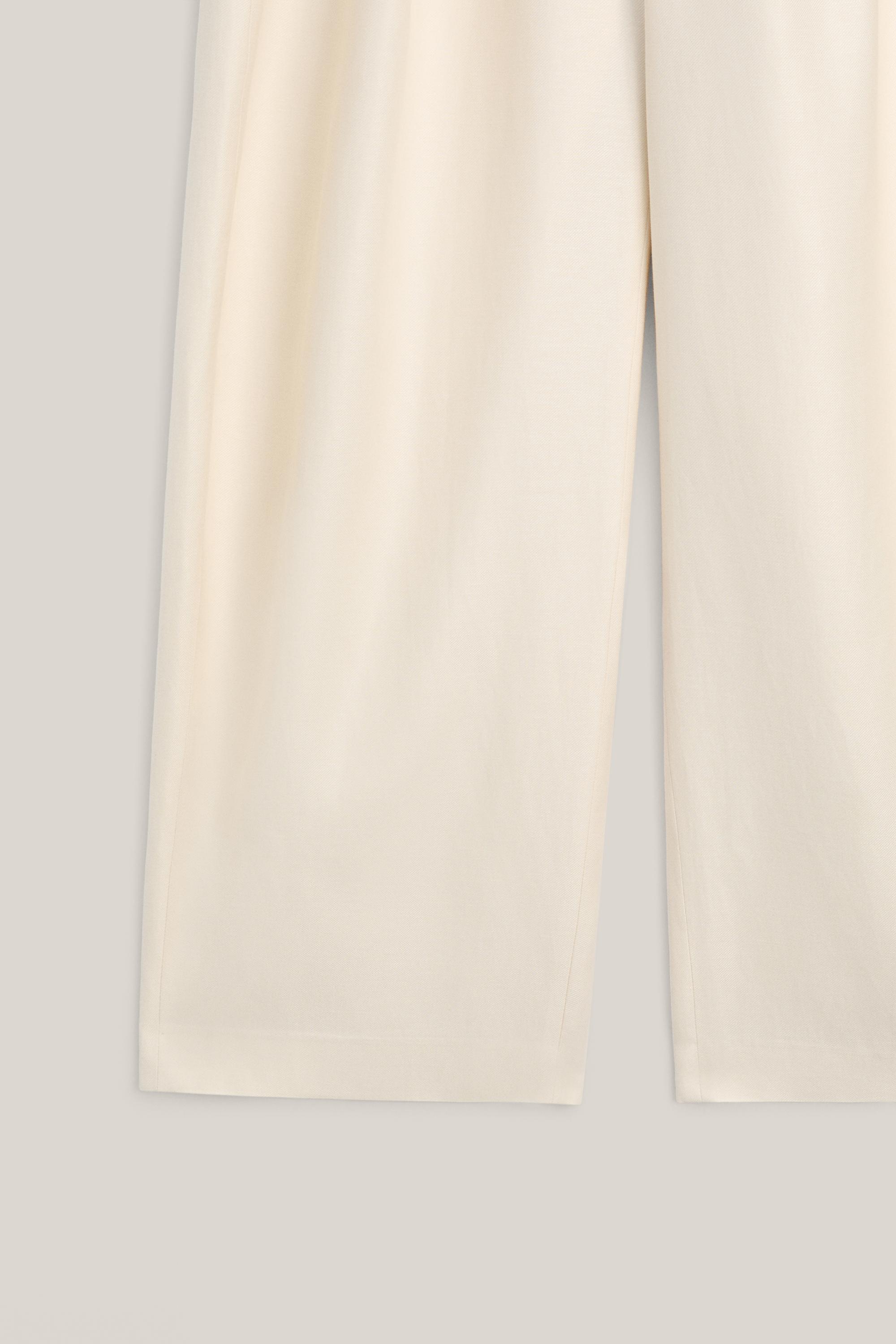 Wide-leg trousers with pleated details - LIMITED EDITION — Off white