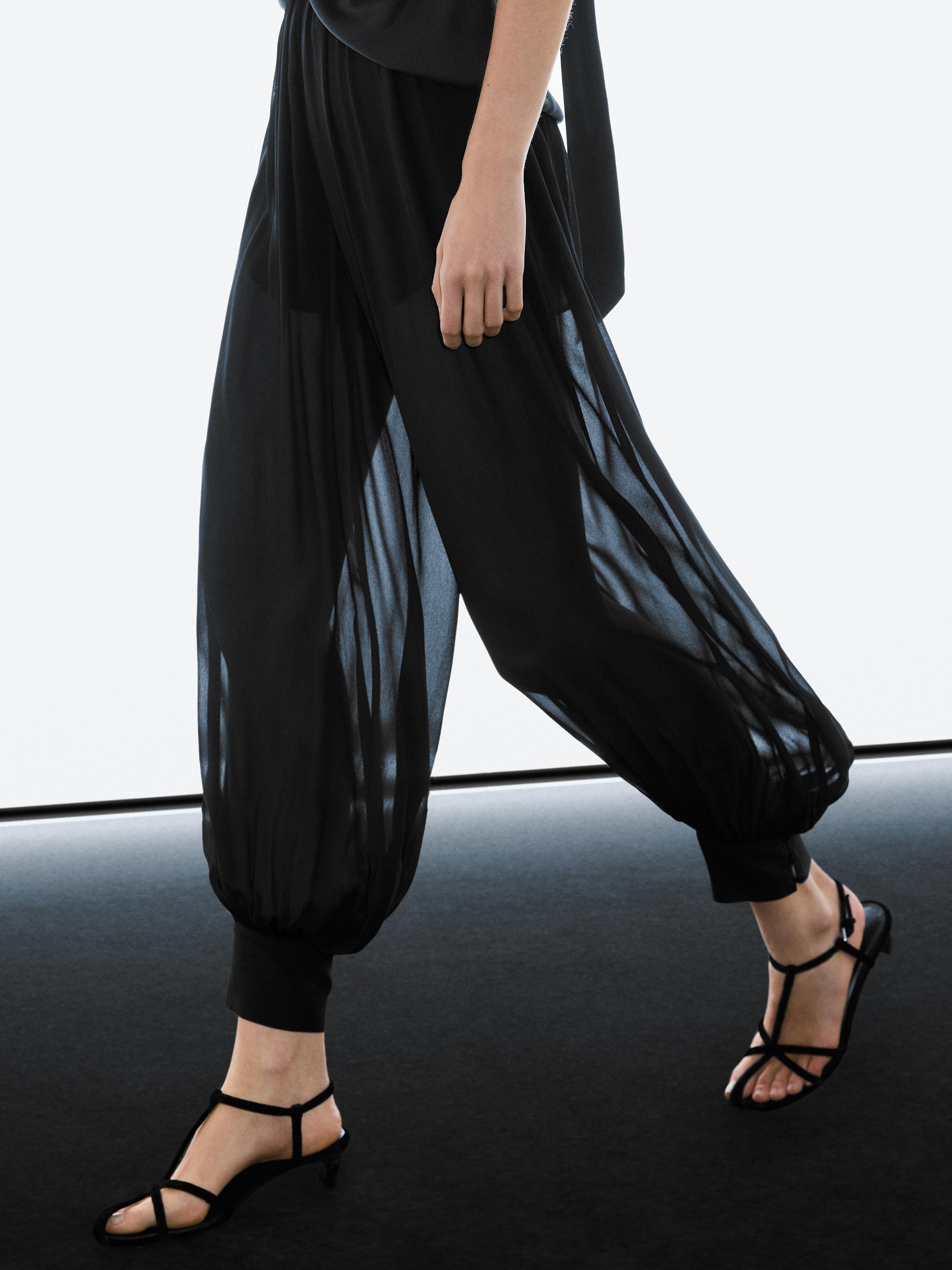 Semi-sheer sarouel trousers with button details — BLACK