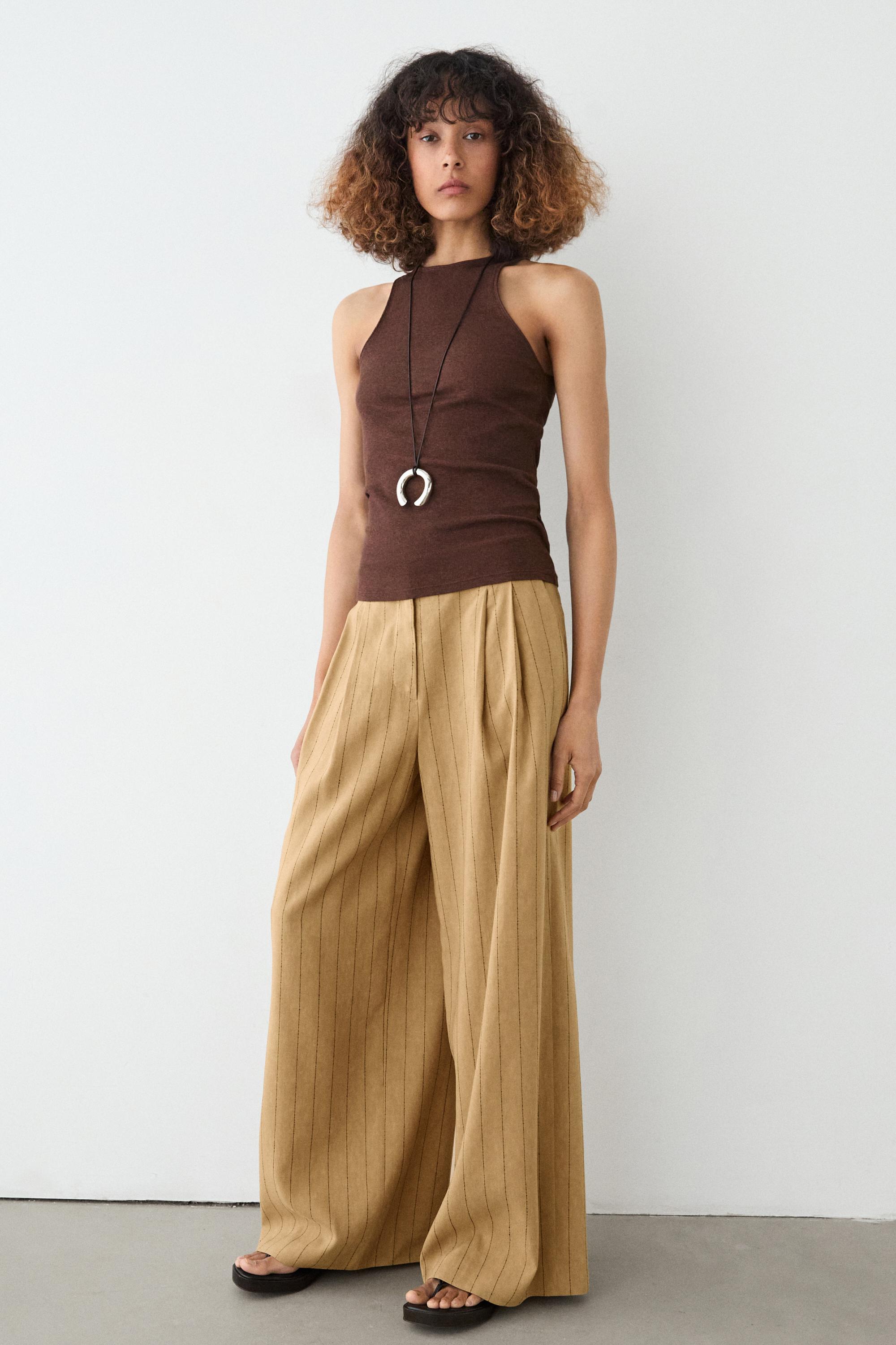 بنطلون بساق عريضة وبنسات