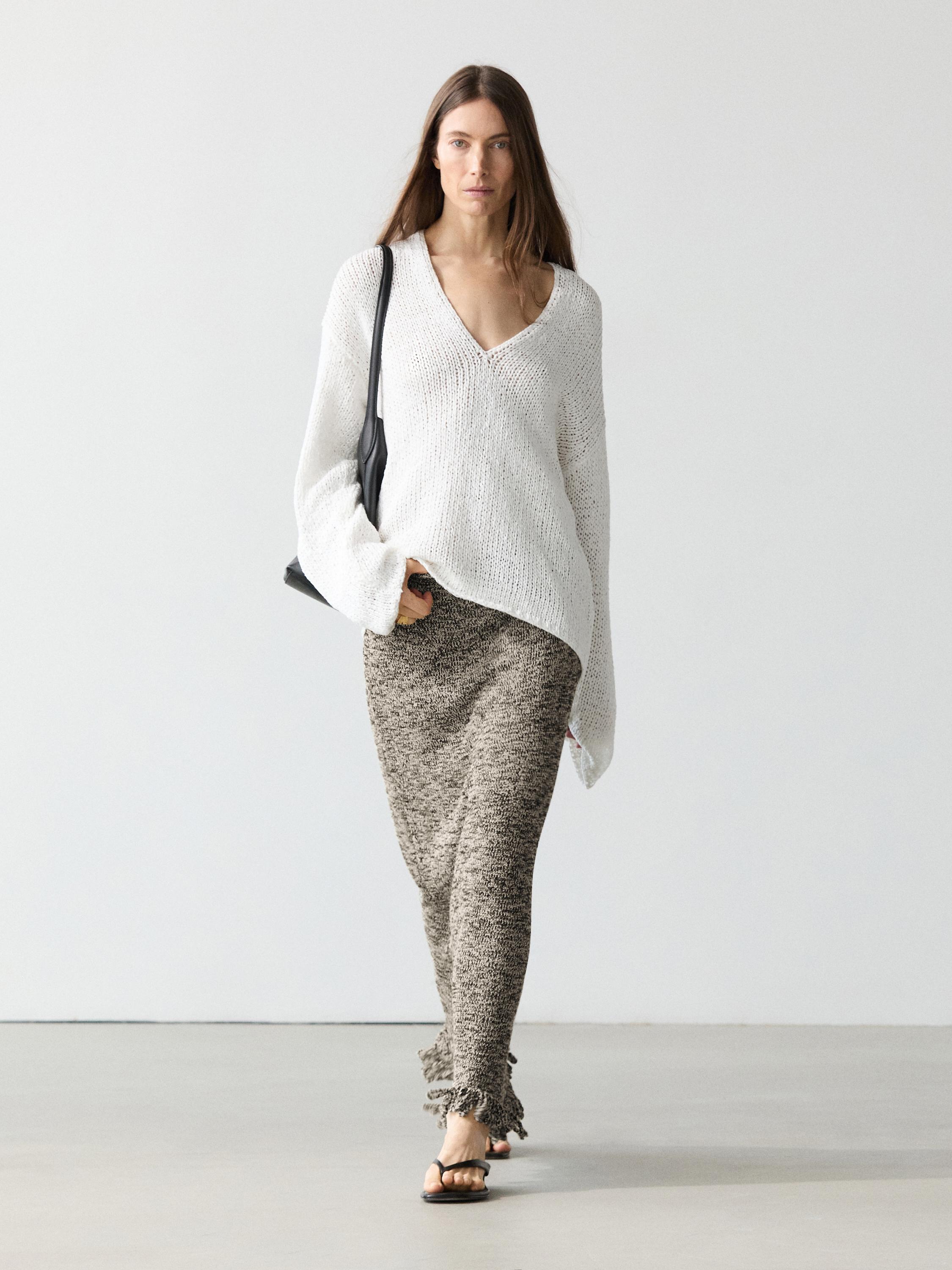 Falda punto detalle flecos total look