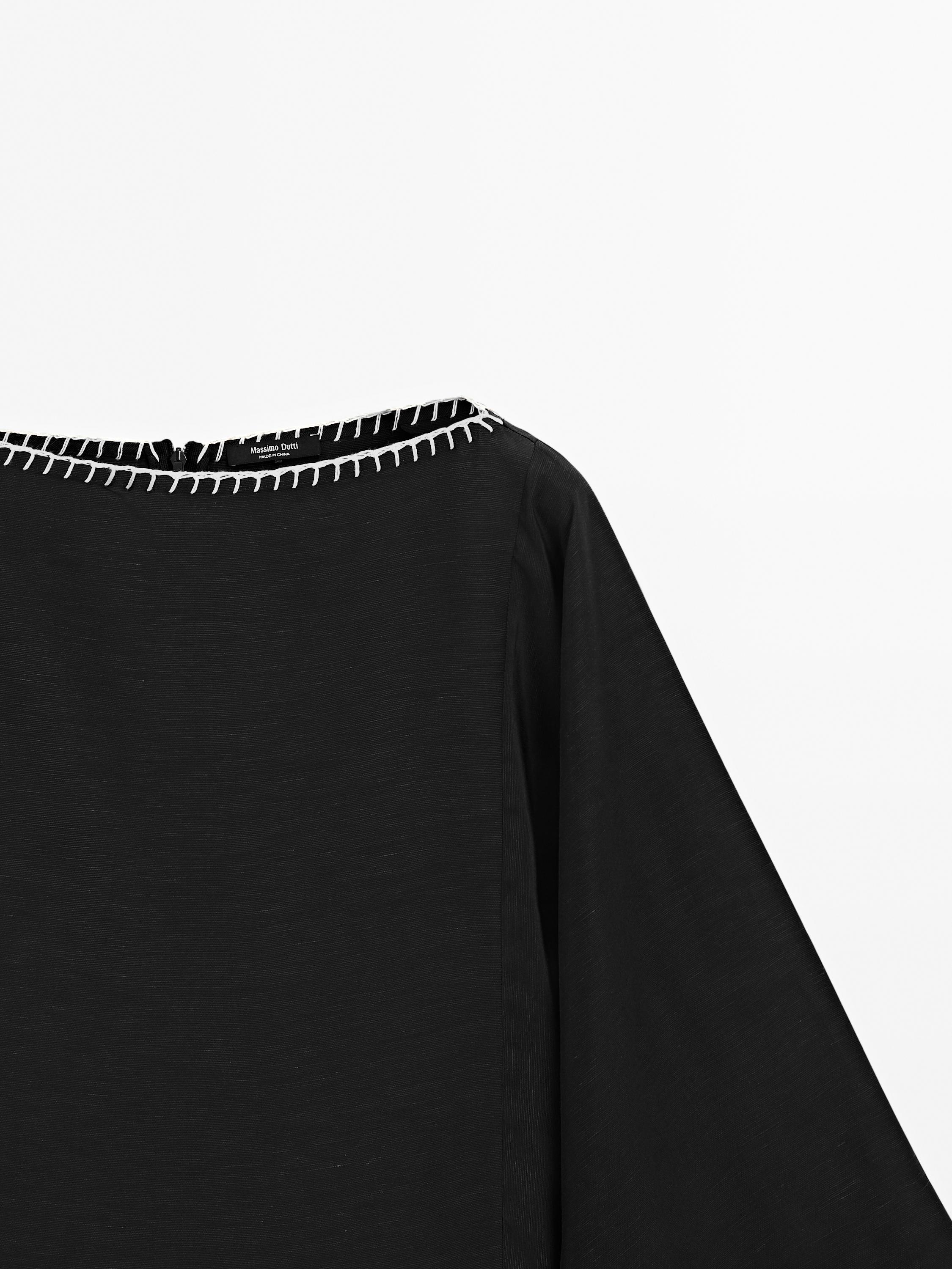 Cape blouse with batwing sleeves
