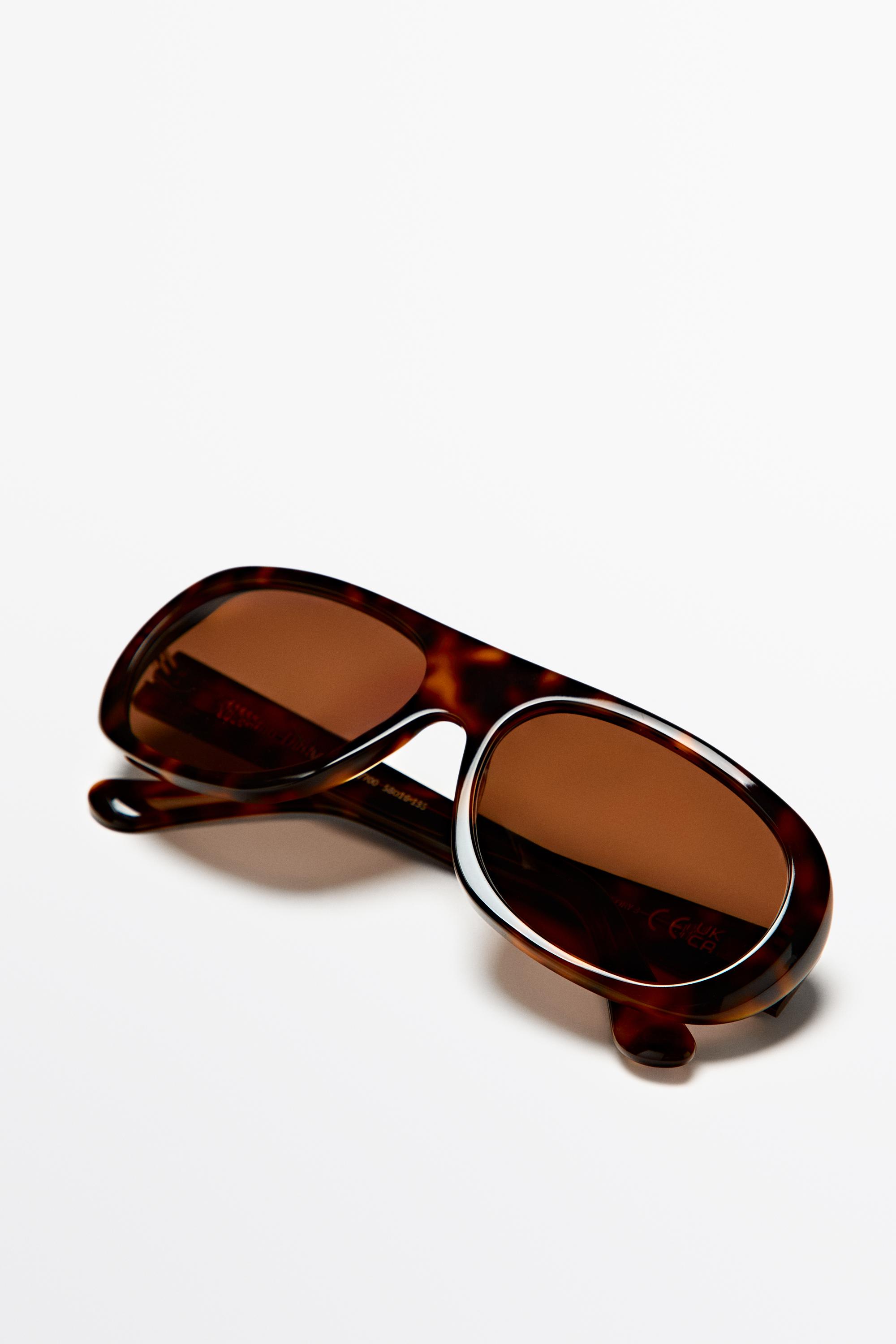 Oval tortoiseshell-effect sunglasses — BROWN