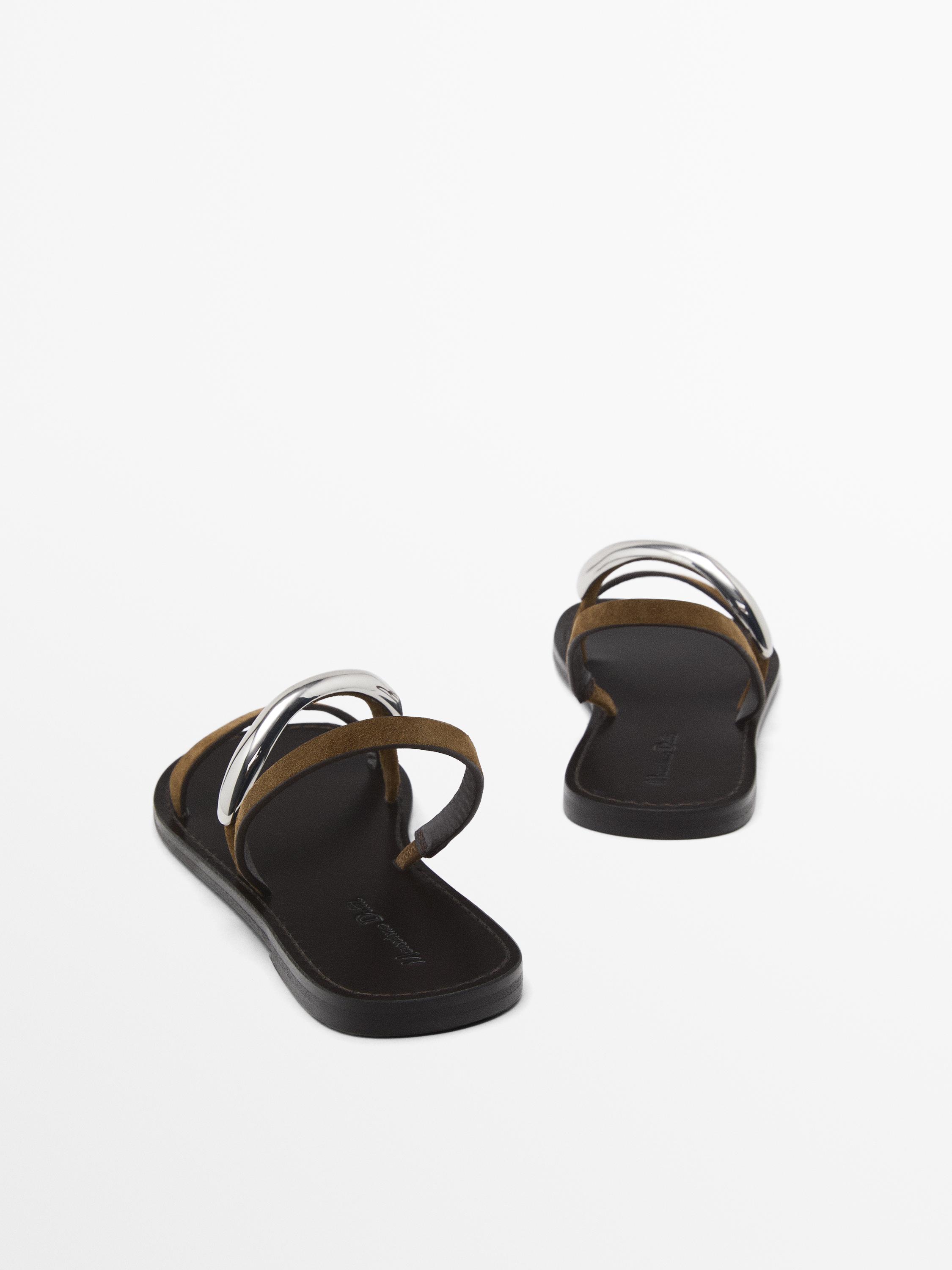 Flat sandals with metallic embellishment