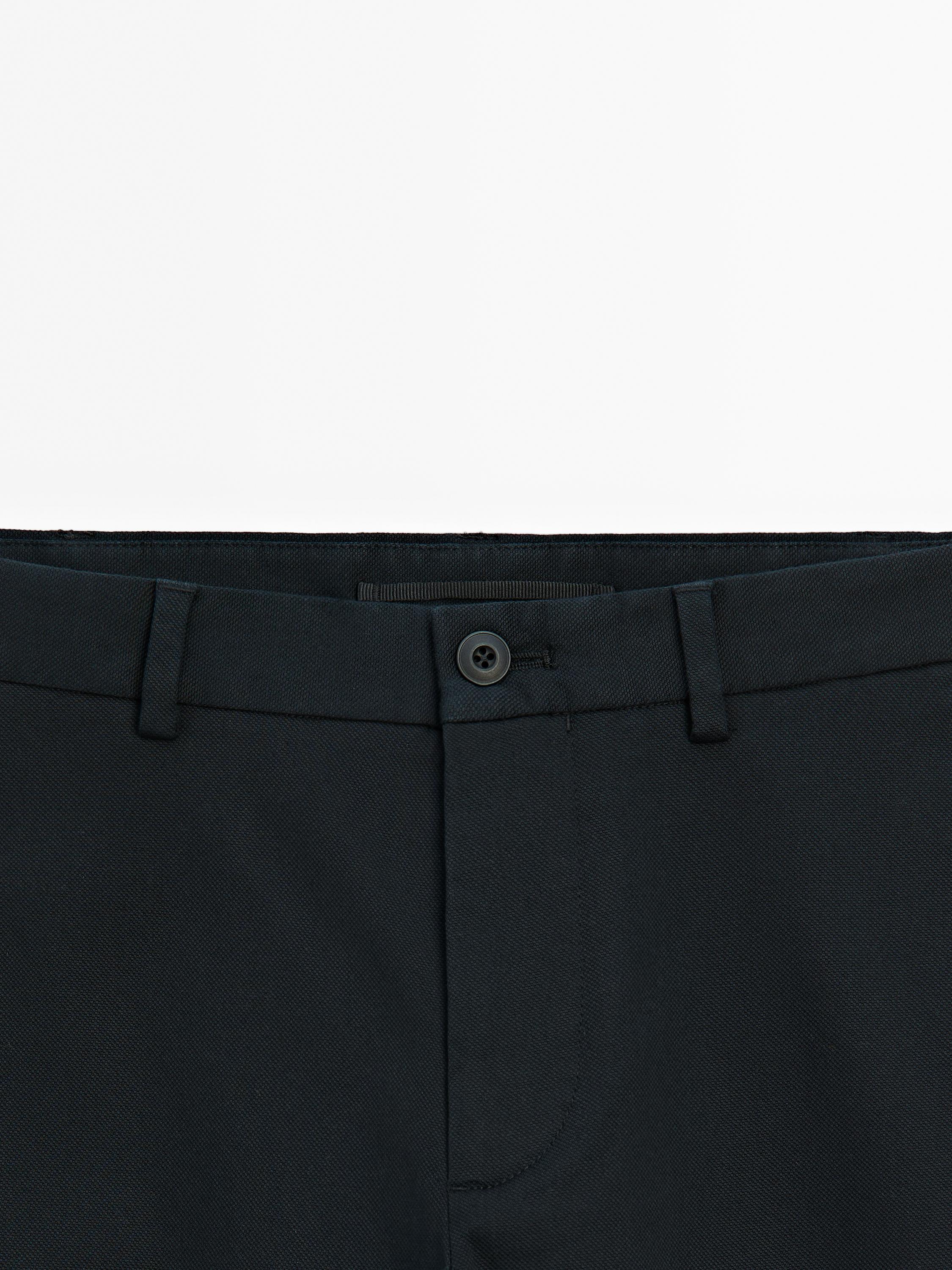 Cotton blend textured slim fit trousers