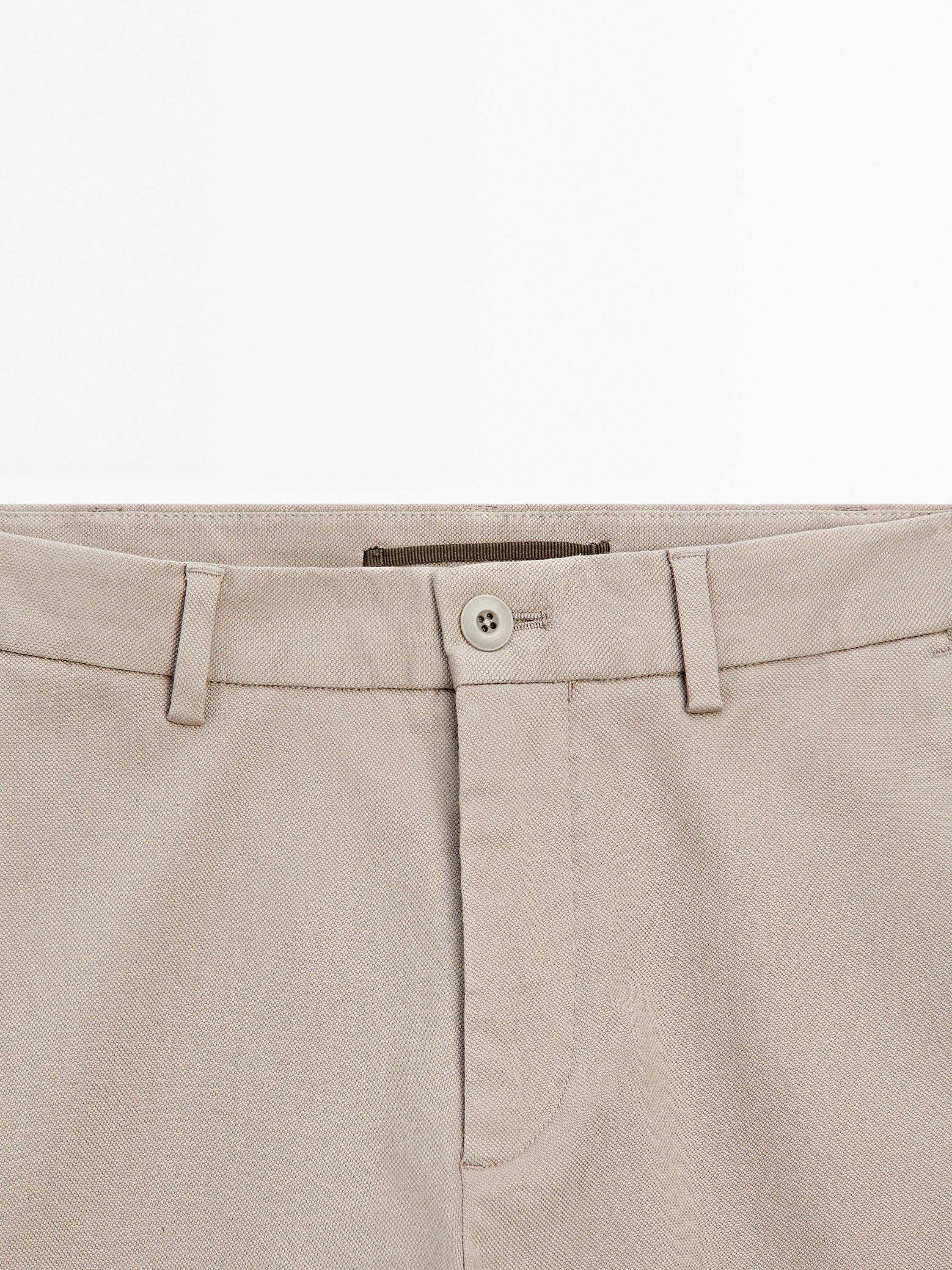 Cotton blend textured slim fit trousers