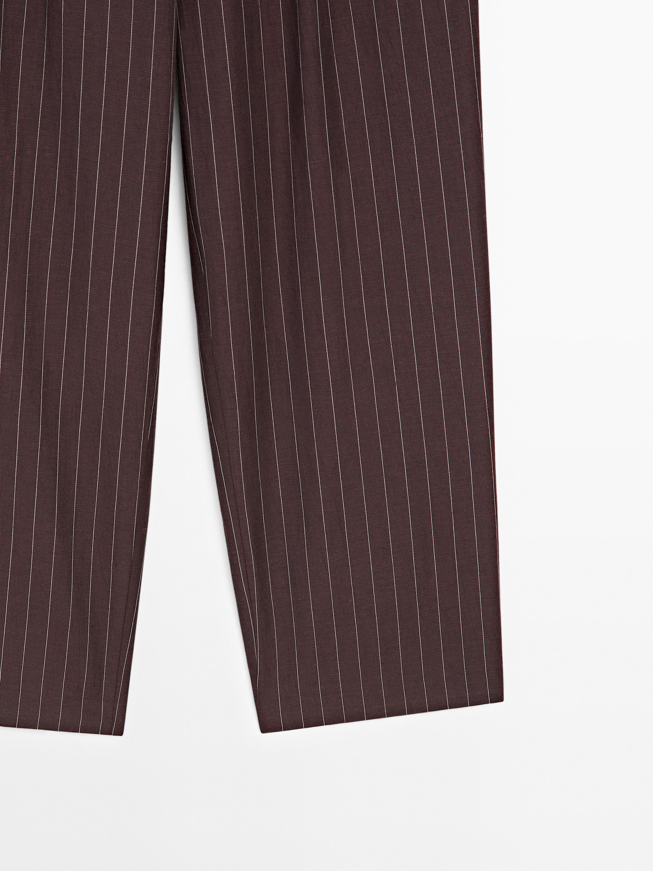 Darted pinstripe trousers