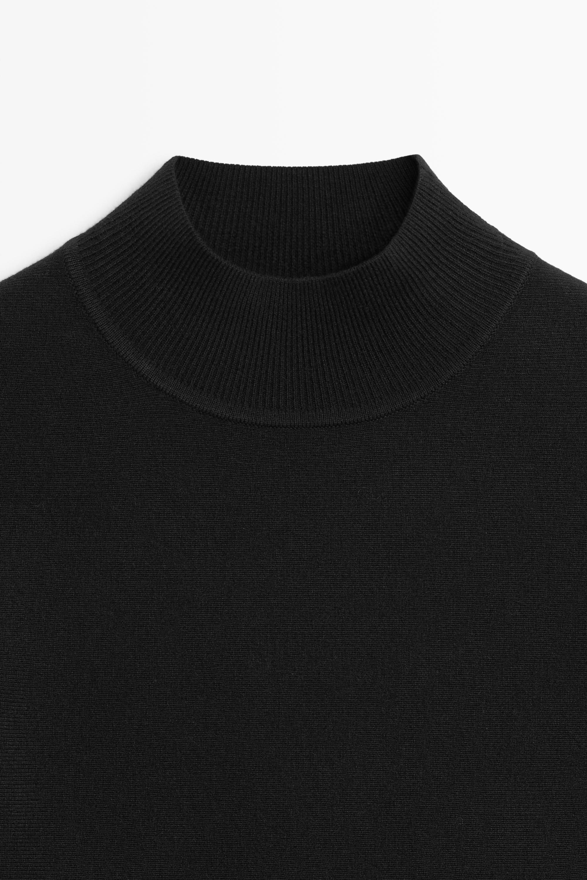 Peplum detail knit top — BLACK