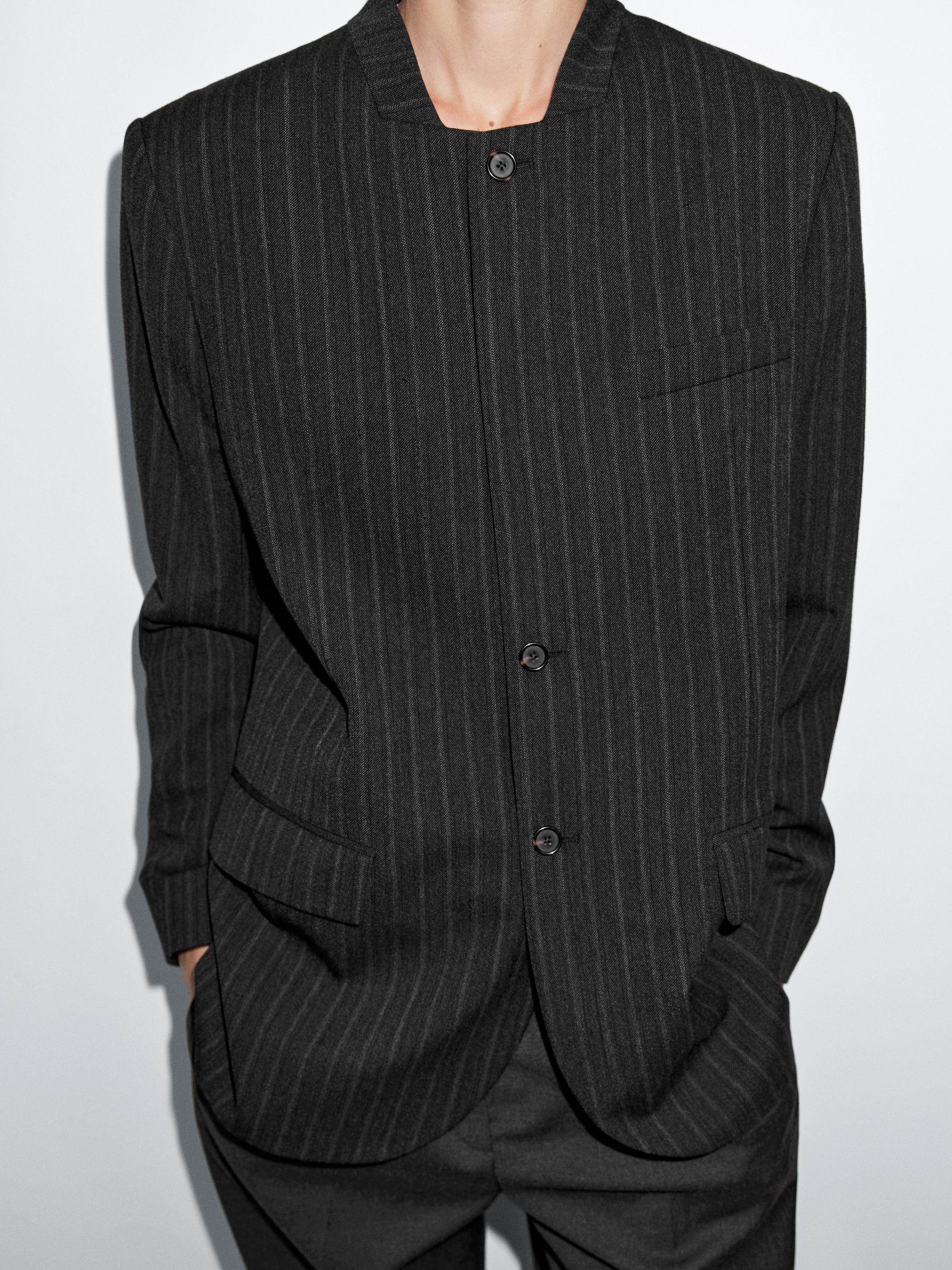 Americana rayas detalle cuello 100% lana