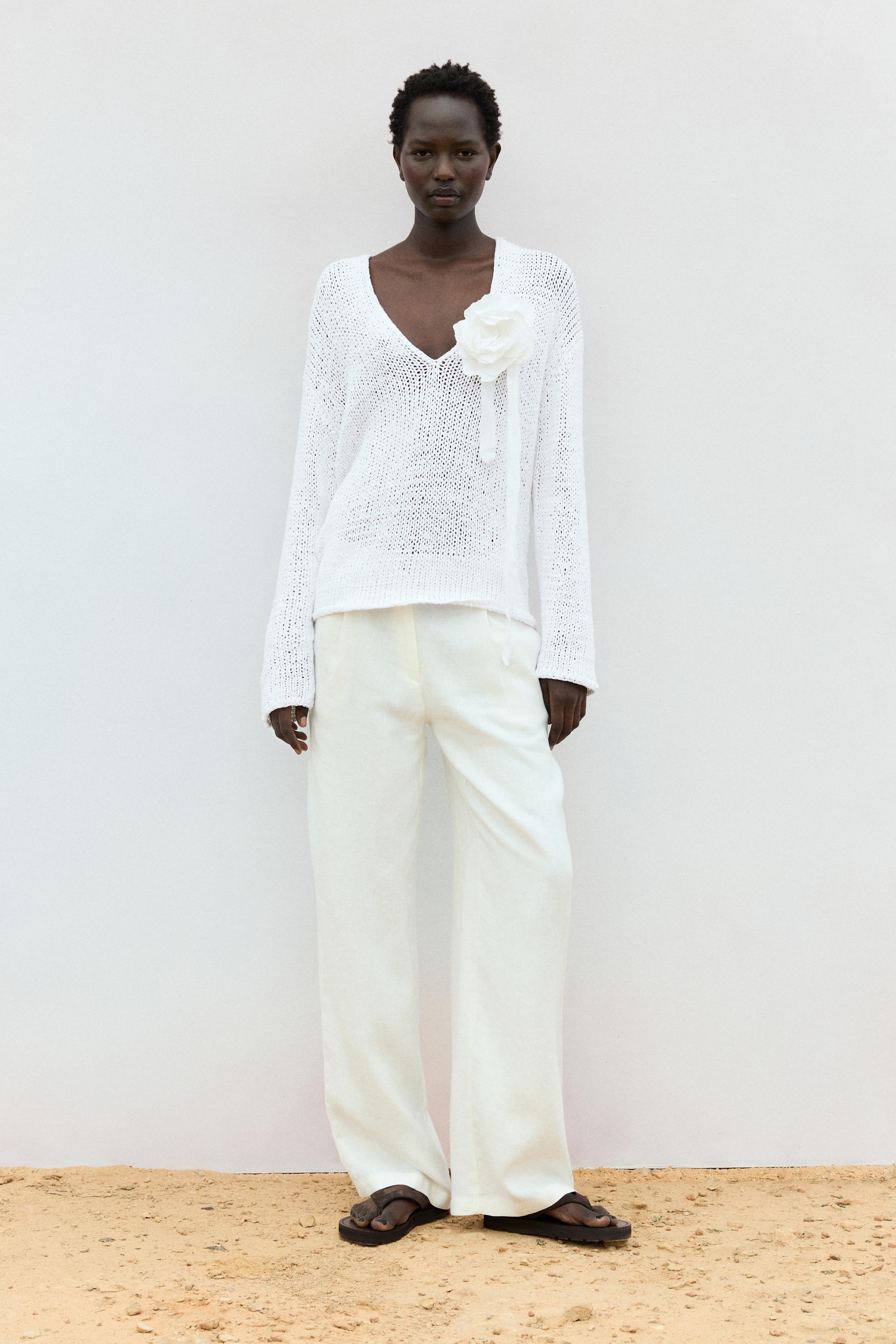 V-neck cutwork sweater