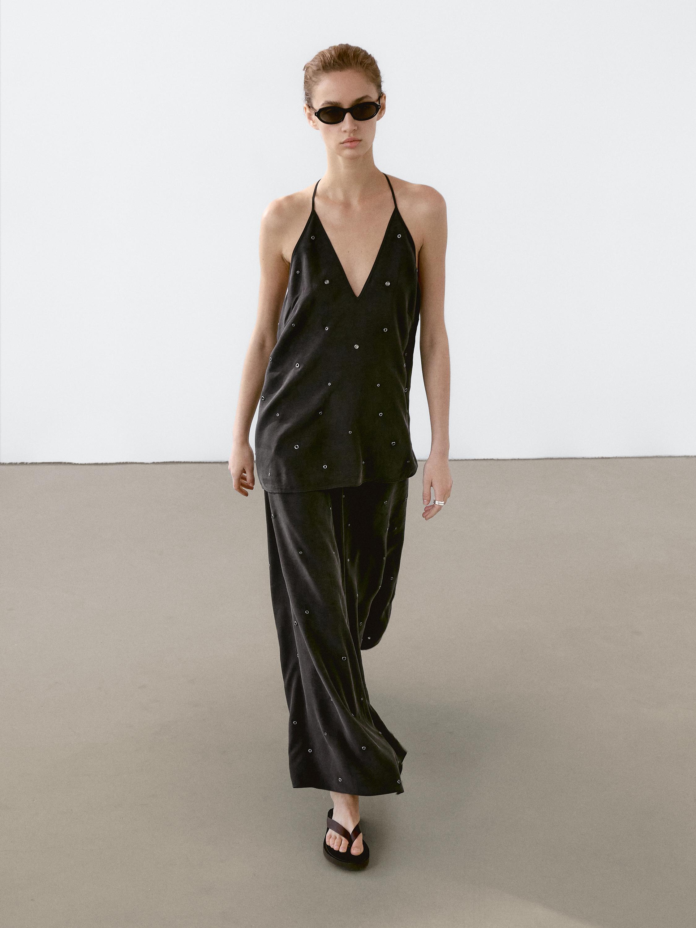 Flowing top with eyelets
