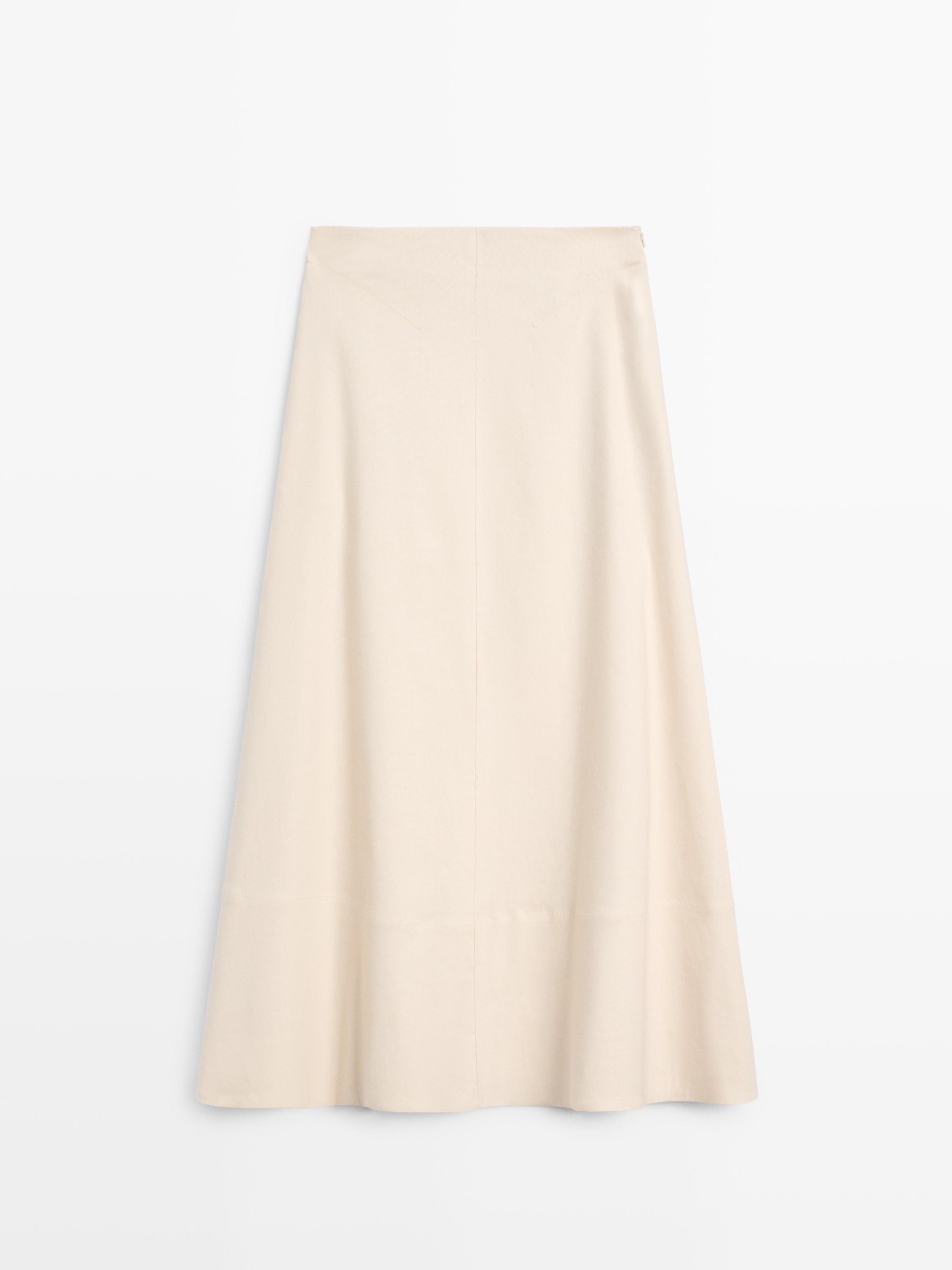 Front view of a raw A-line skirt, long cut and A-line, with no visible pockets.
