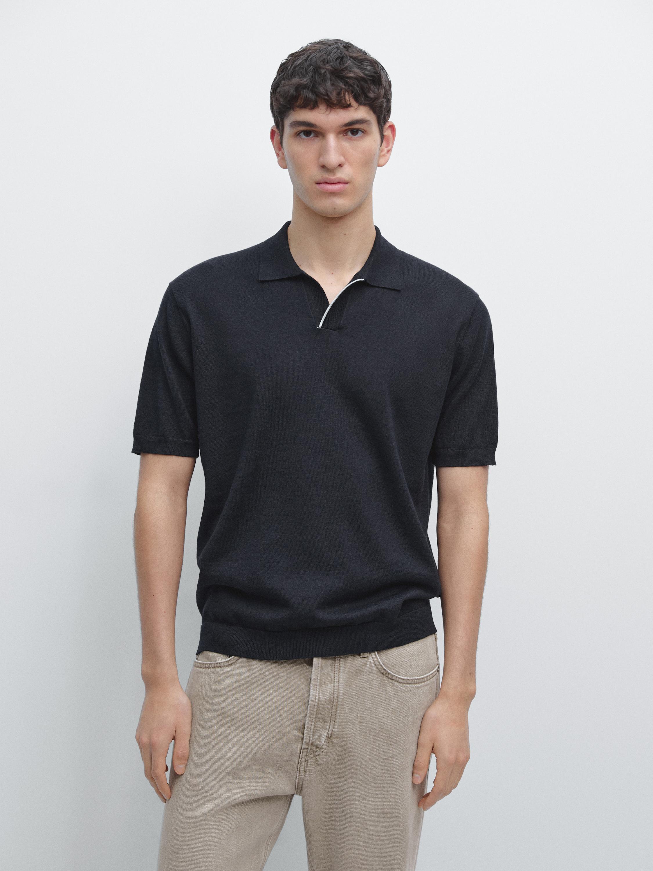 Navy blue knit polo set with short sleeves and a classic collar, paired with beige pants with front pockets.