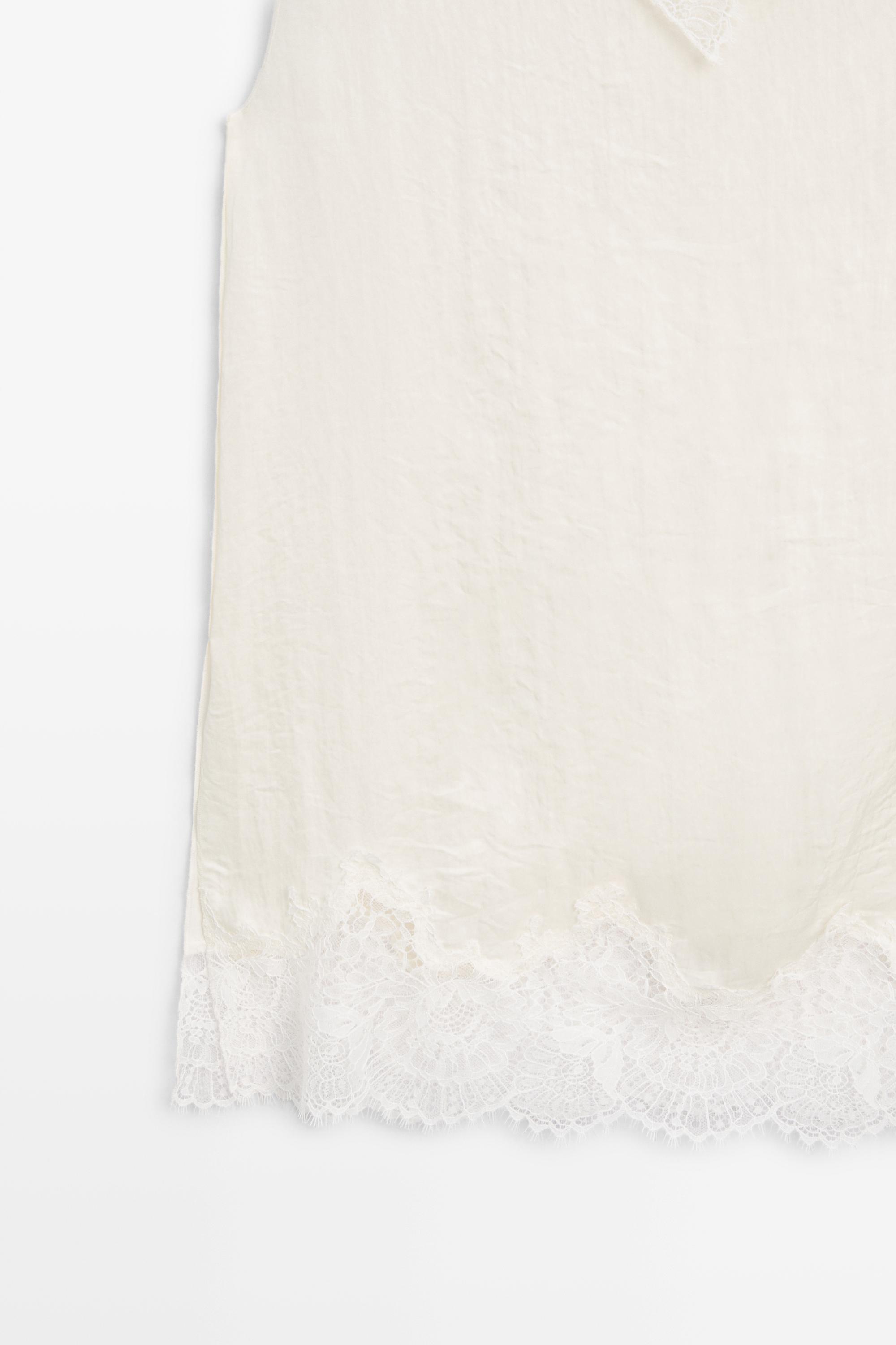 Asymmetric roll neck top with lace detail — CREAM