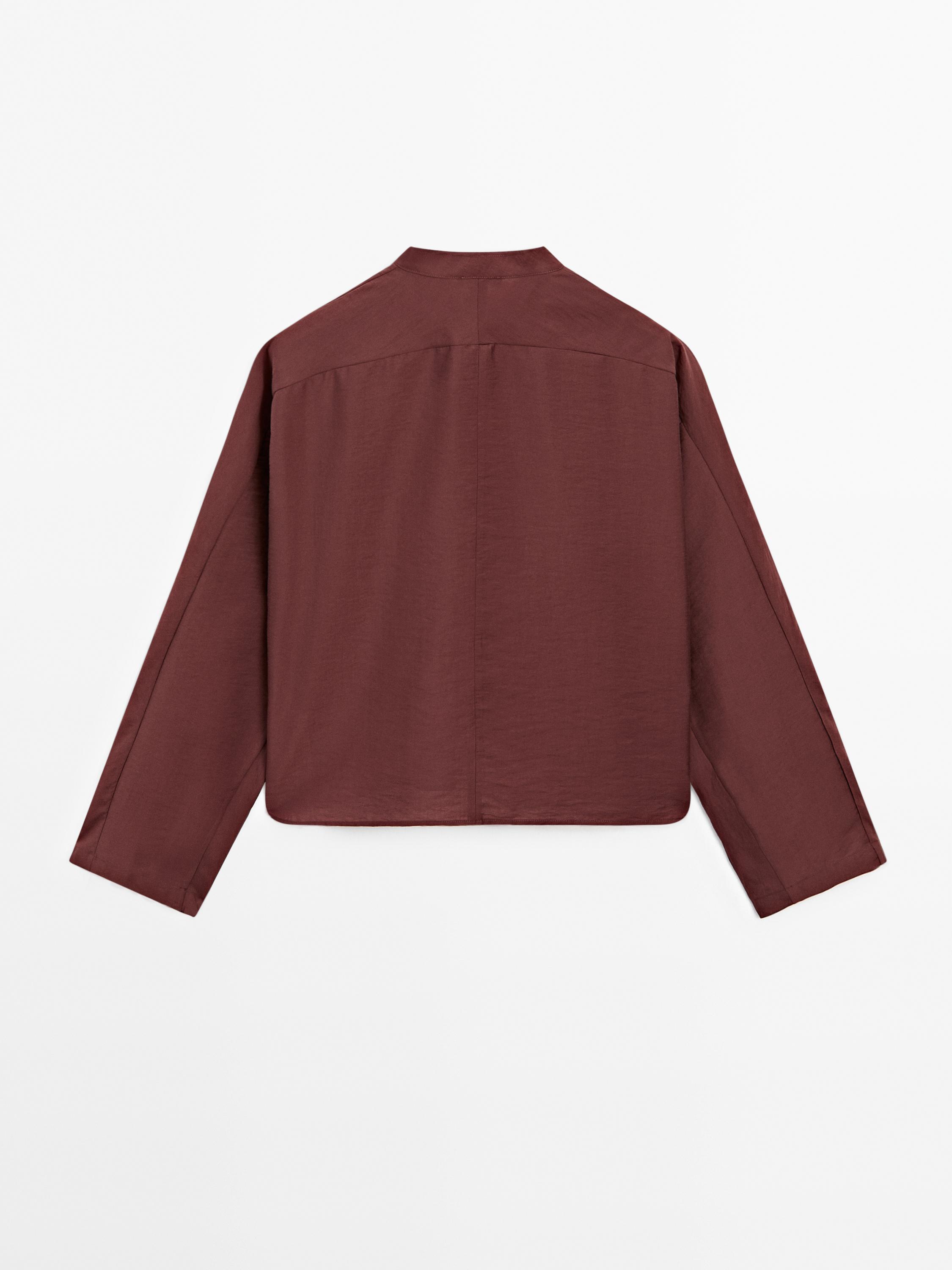 Flowing blouse with fastening detail