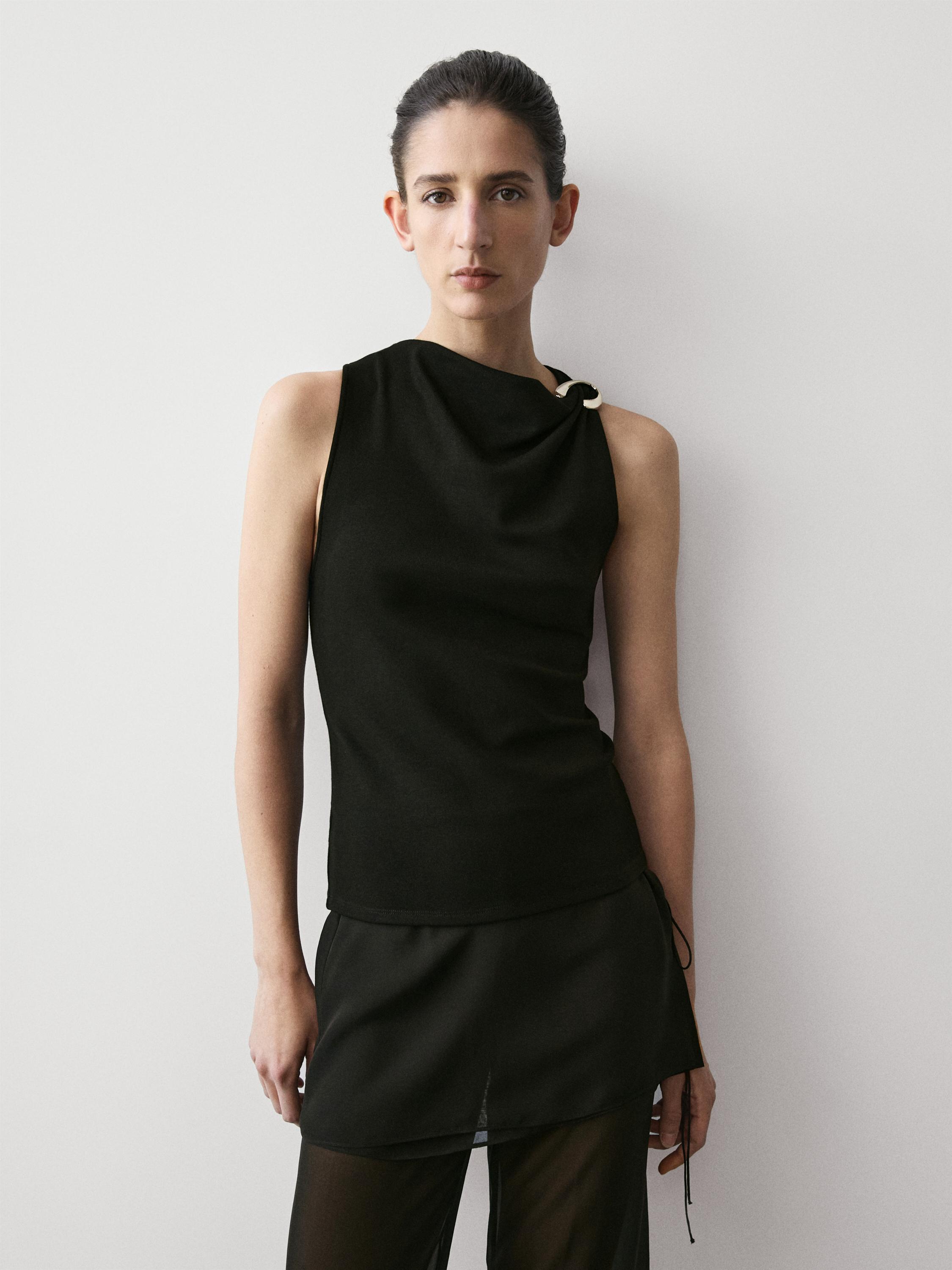 Draped neckline top with brooch detail