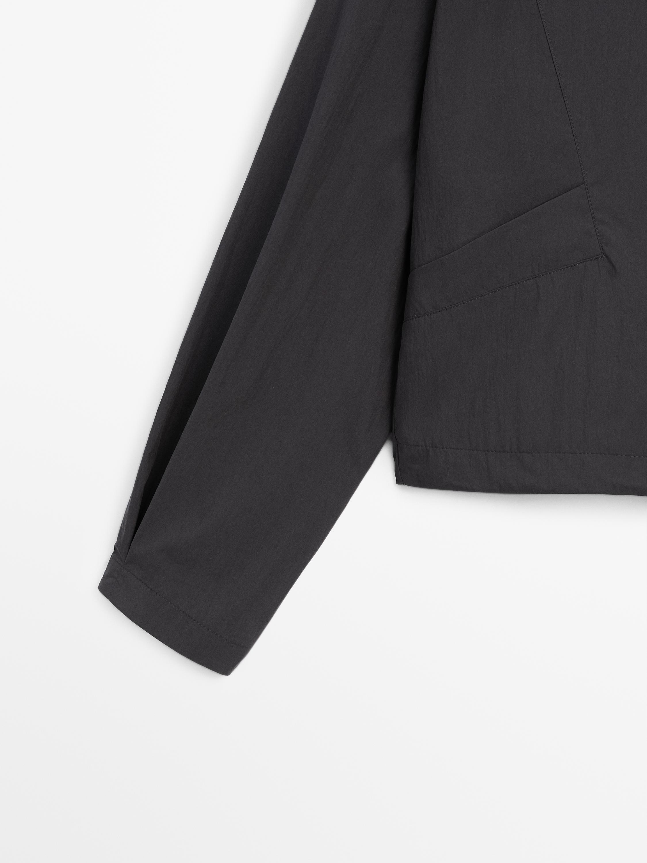 Bomber jacket with seams and gathering