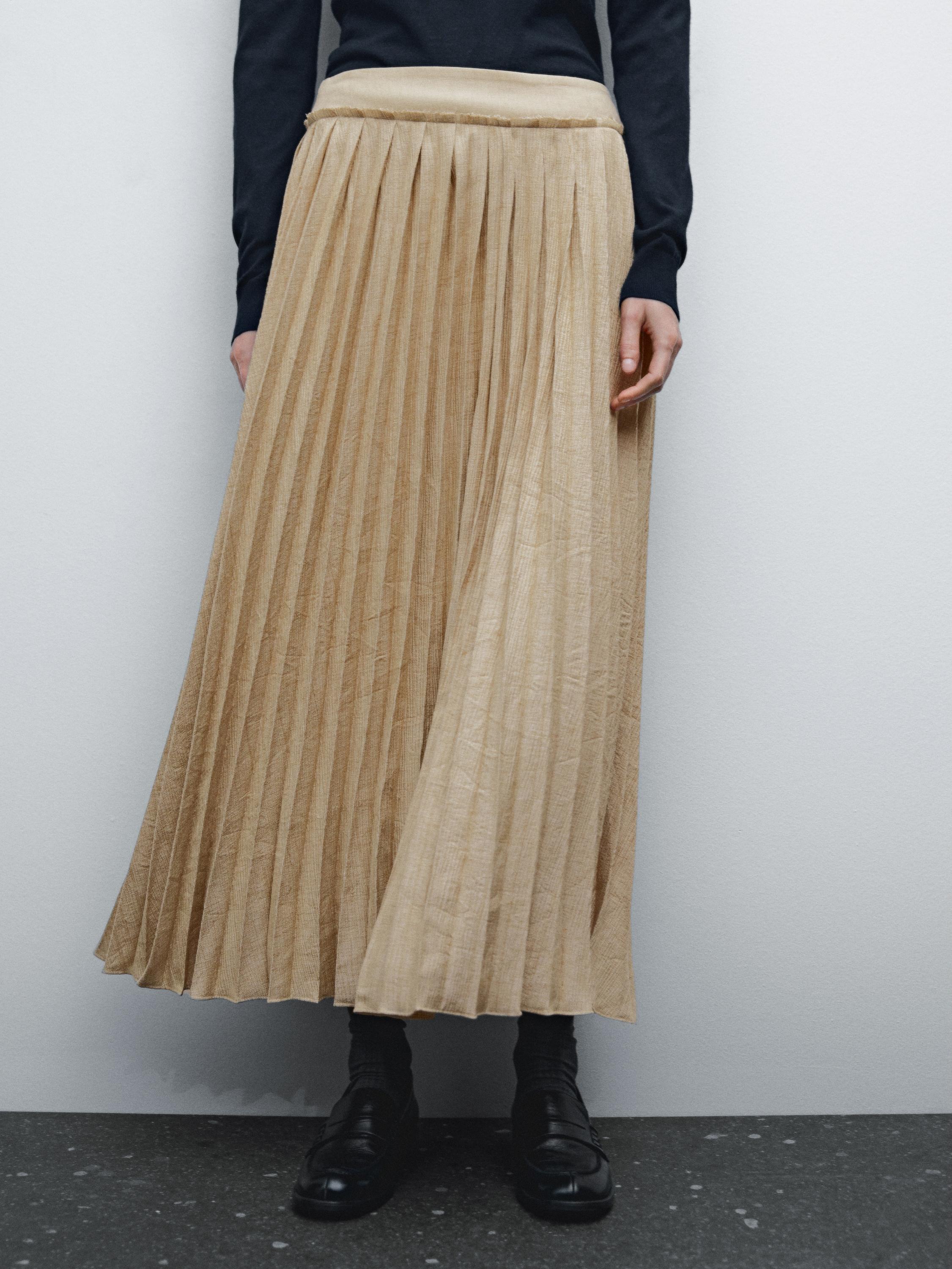 Pleated midi skirt with fabric detail