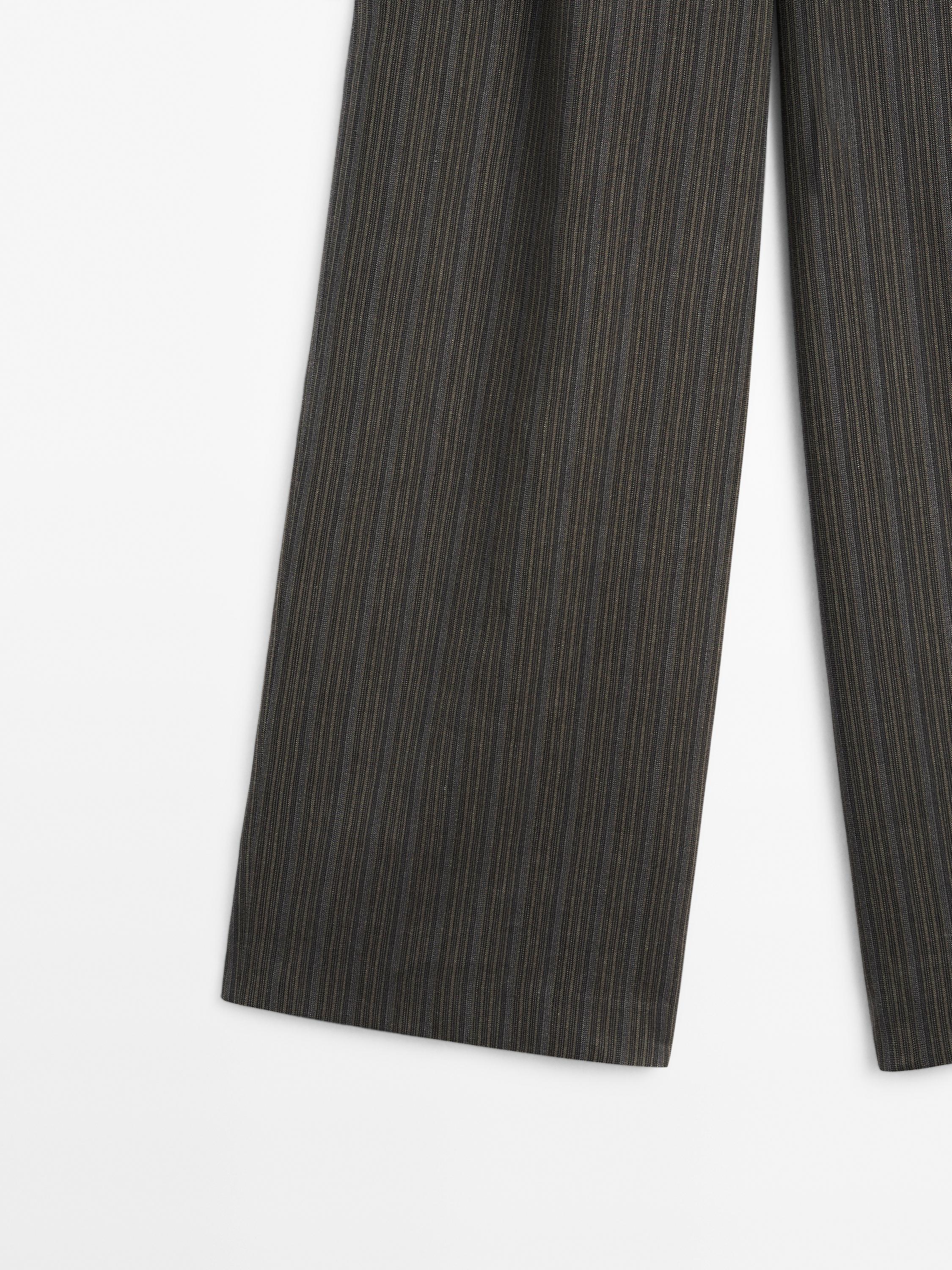 Multi-stripe trousers with belt detail