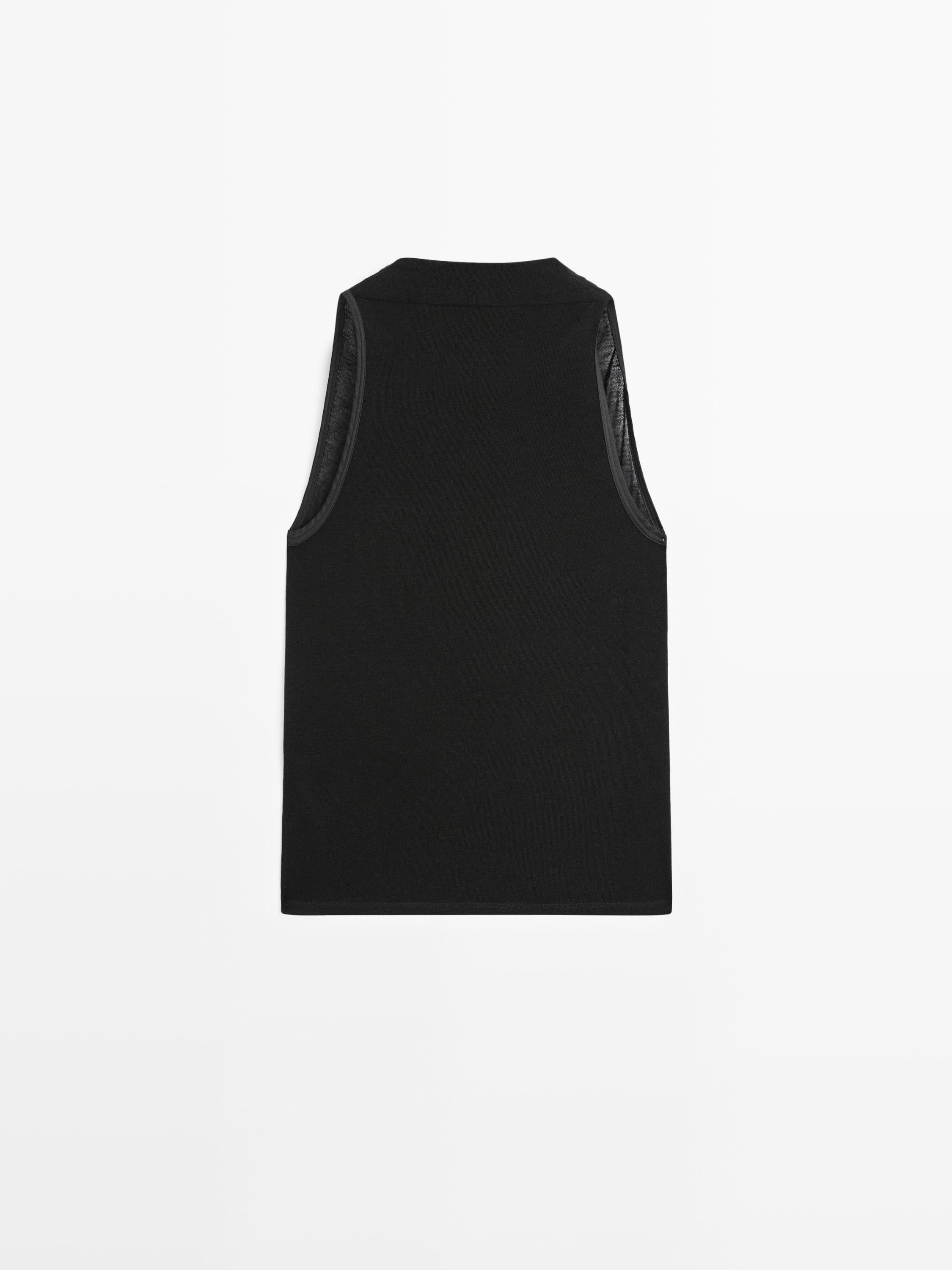 Sleeveless top with draped neckline