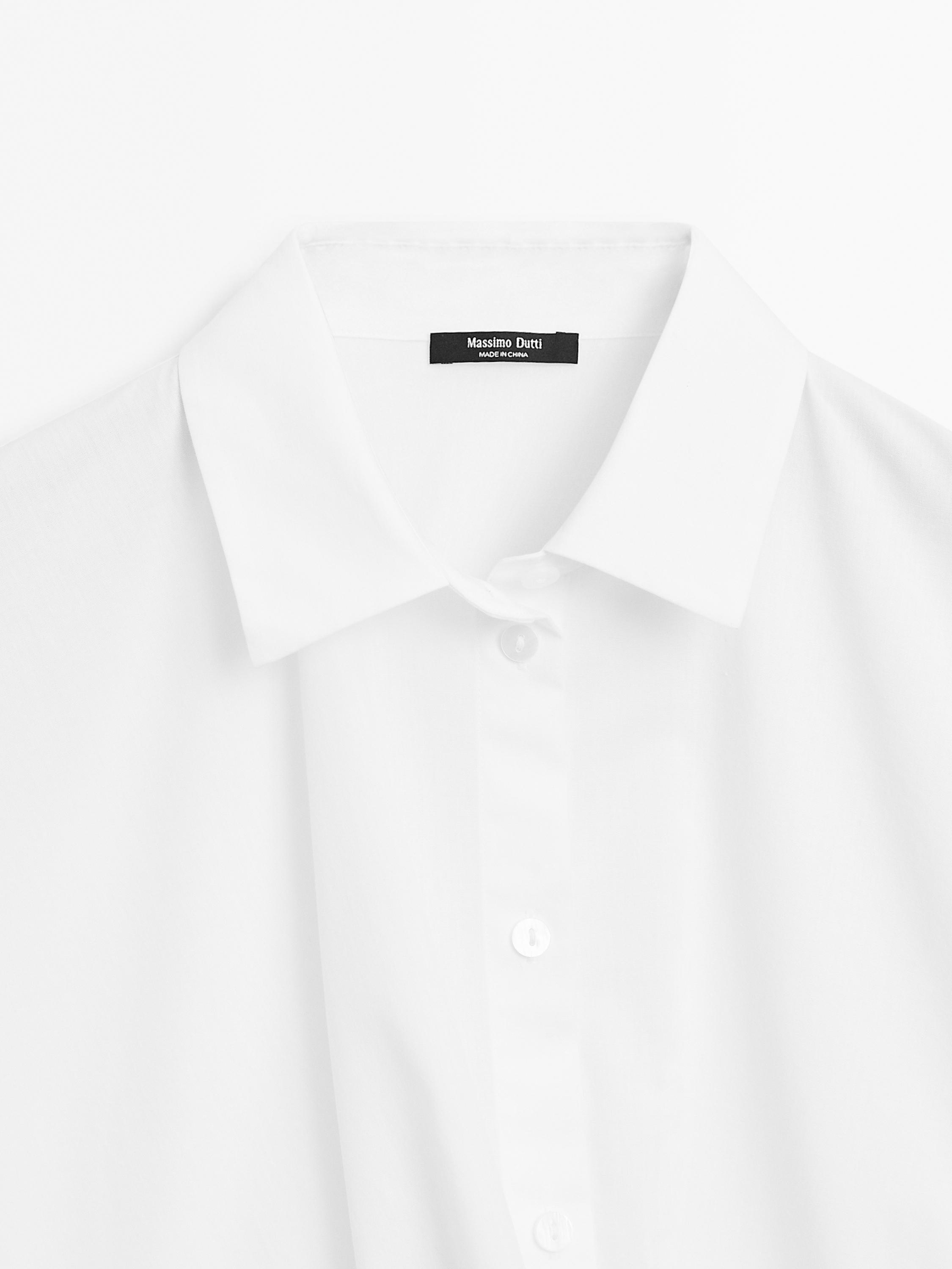 100% cotton shirt with draped asymmetric hem