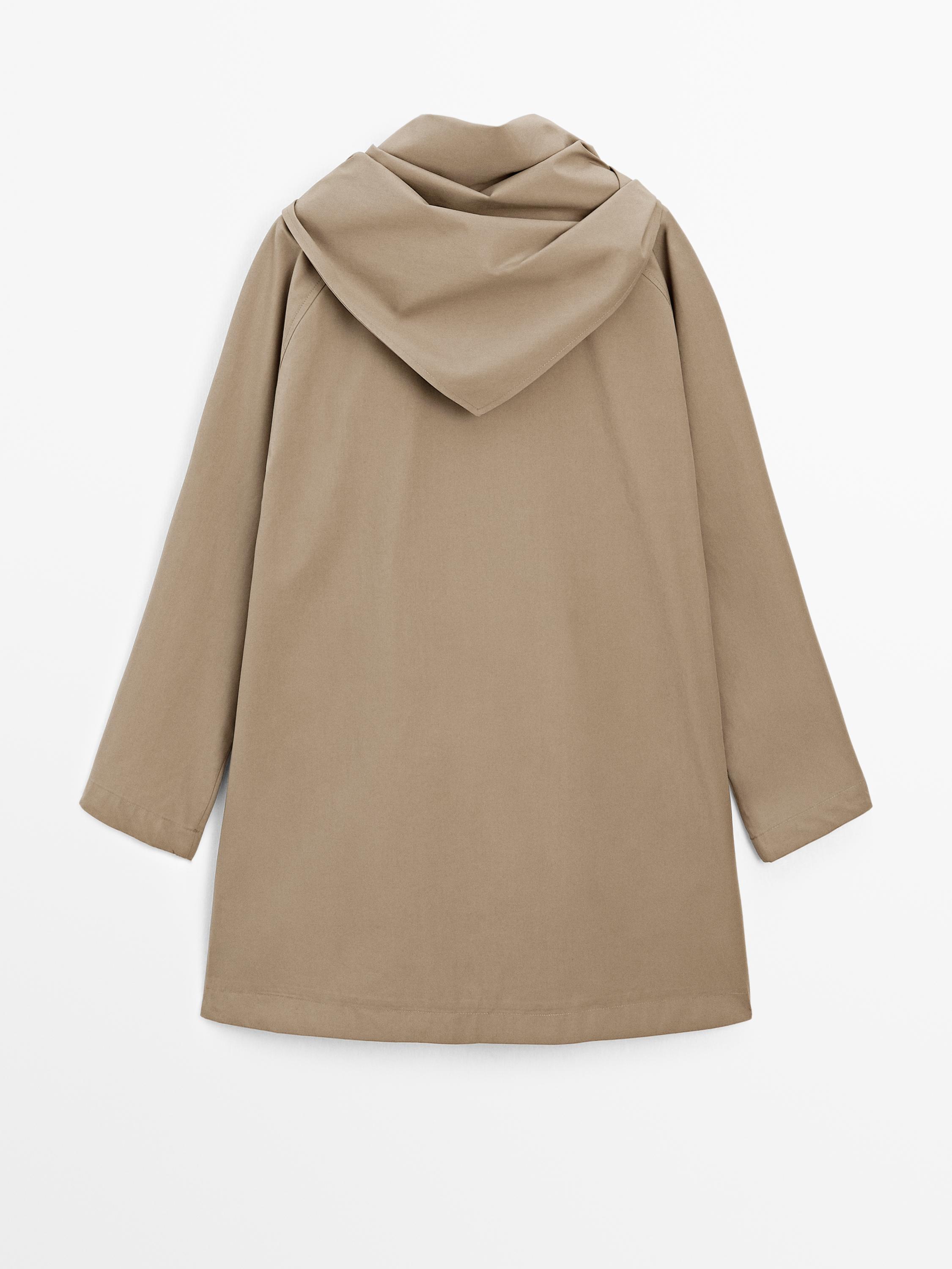 Trench coat with detachable scarf detail