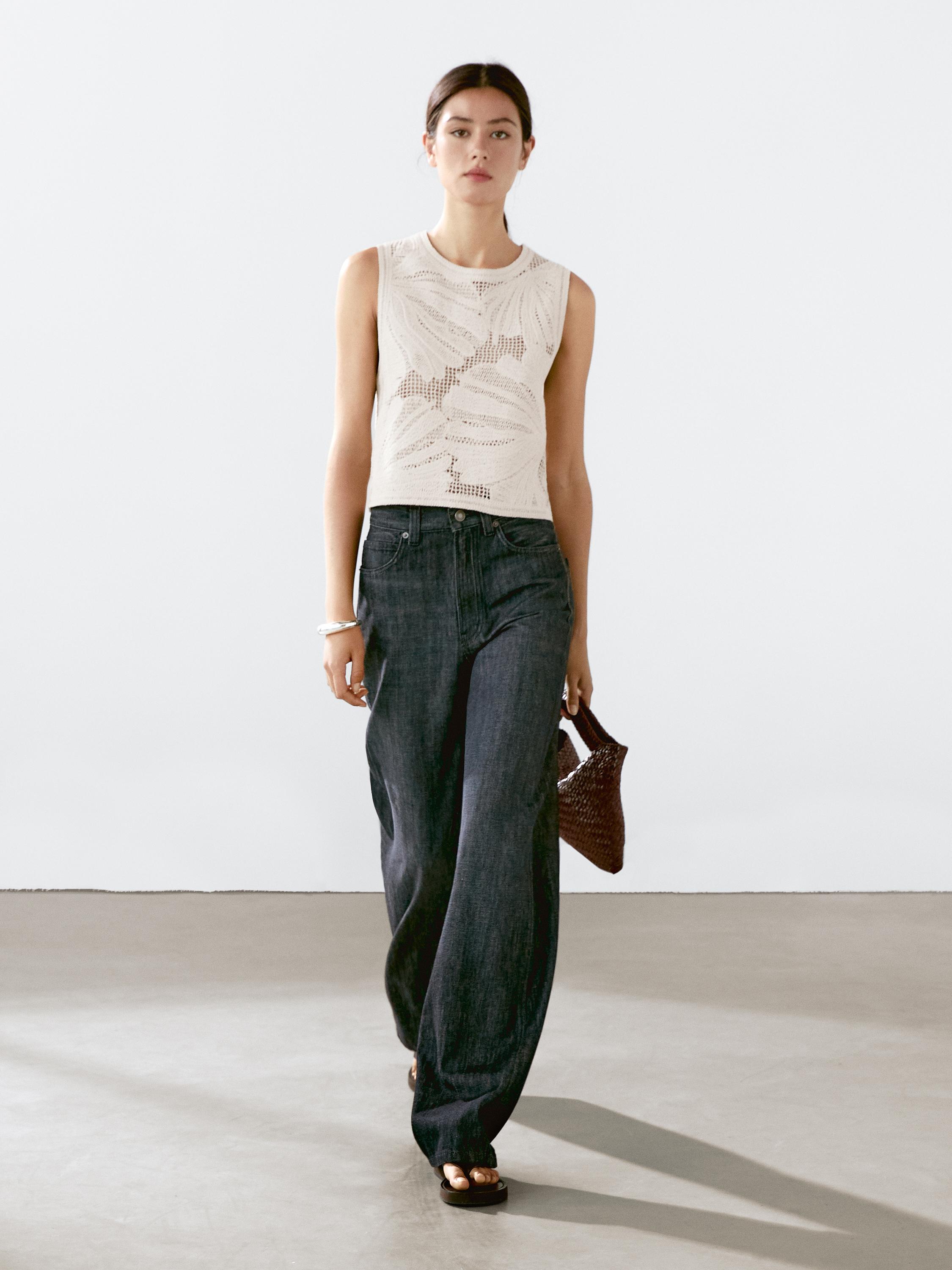 Openwork crochet top with flower detail
